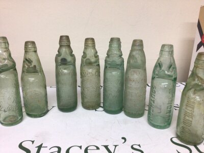 A collection of Victorian and later Codd bottles all with moulded trade labels including local W Ingram Southend James Cox London Lawrence Green Southend and many more.(8) NO RESERVE.