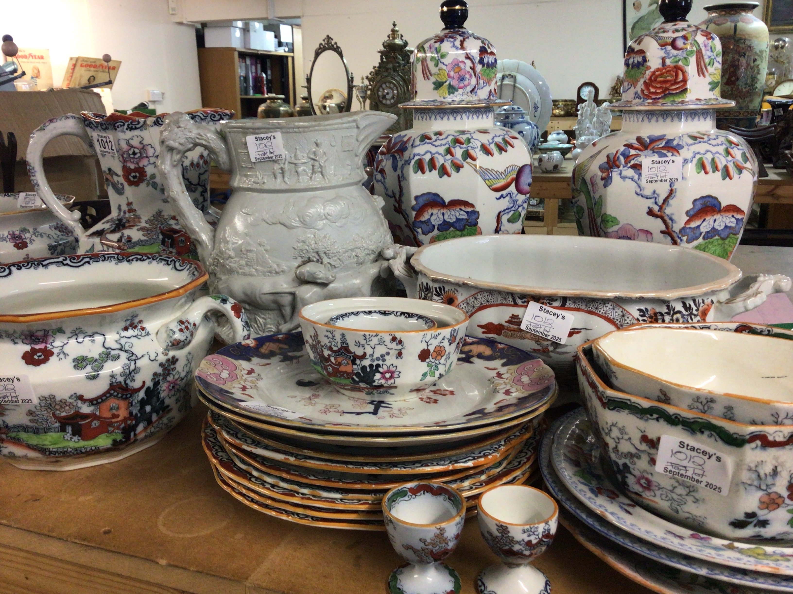 A large collection of Victorian and later Ironstone china including a Masons hunting jug with raised relief plates vases jugs chamber pots. No Reserve.