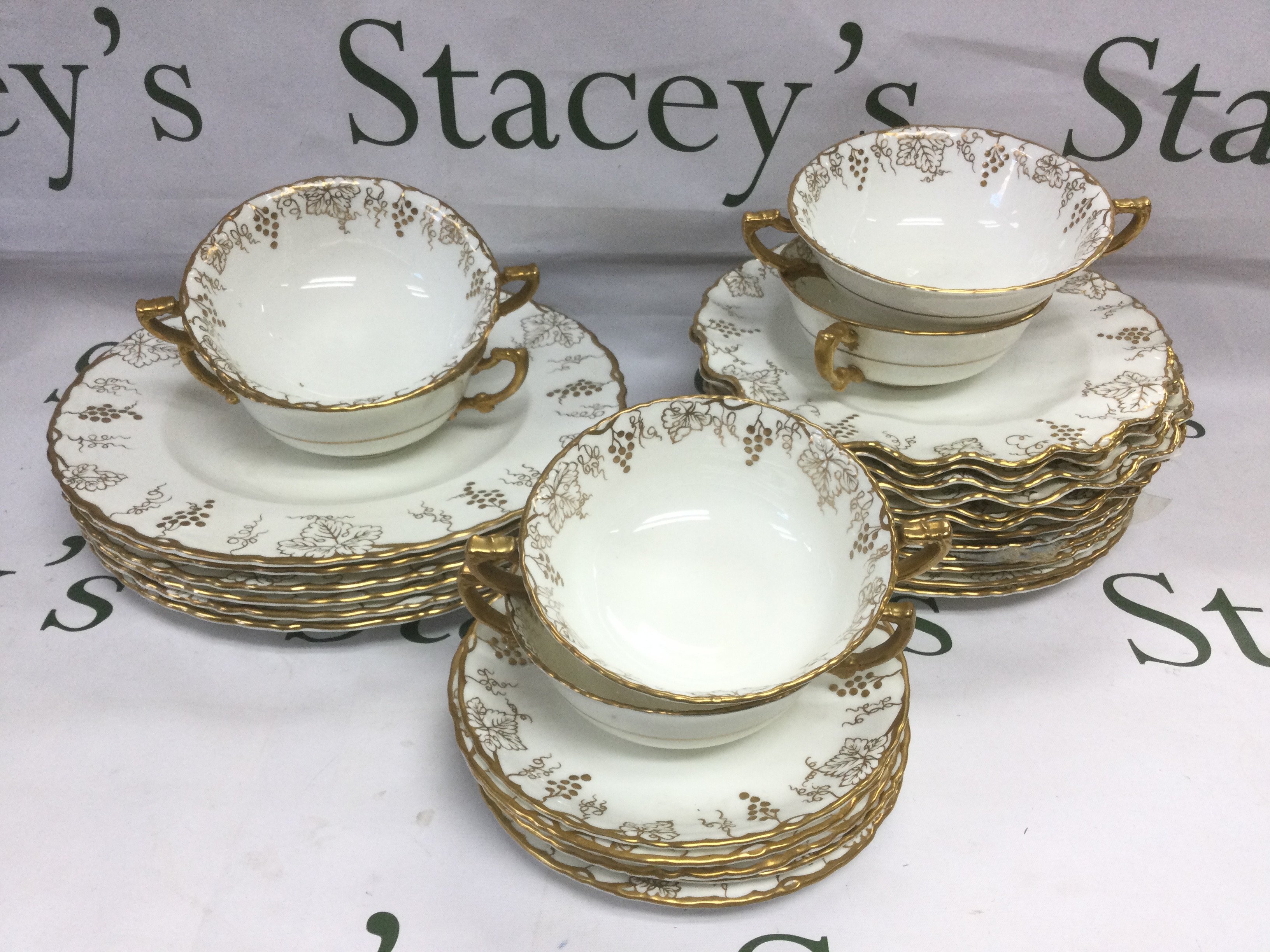 A collection of Royal Crown Derby plates and soup bowls in Vine pattern. Shipping category D.