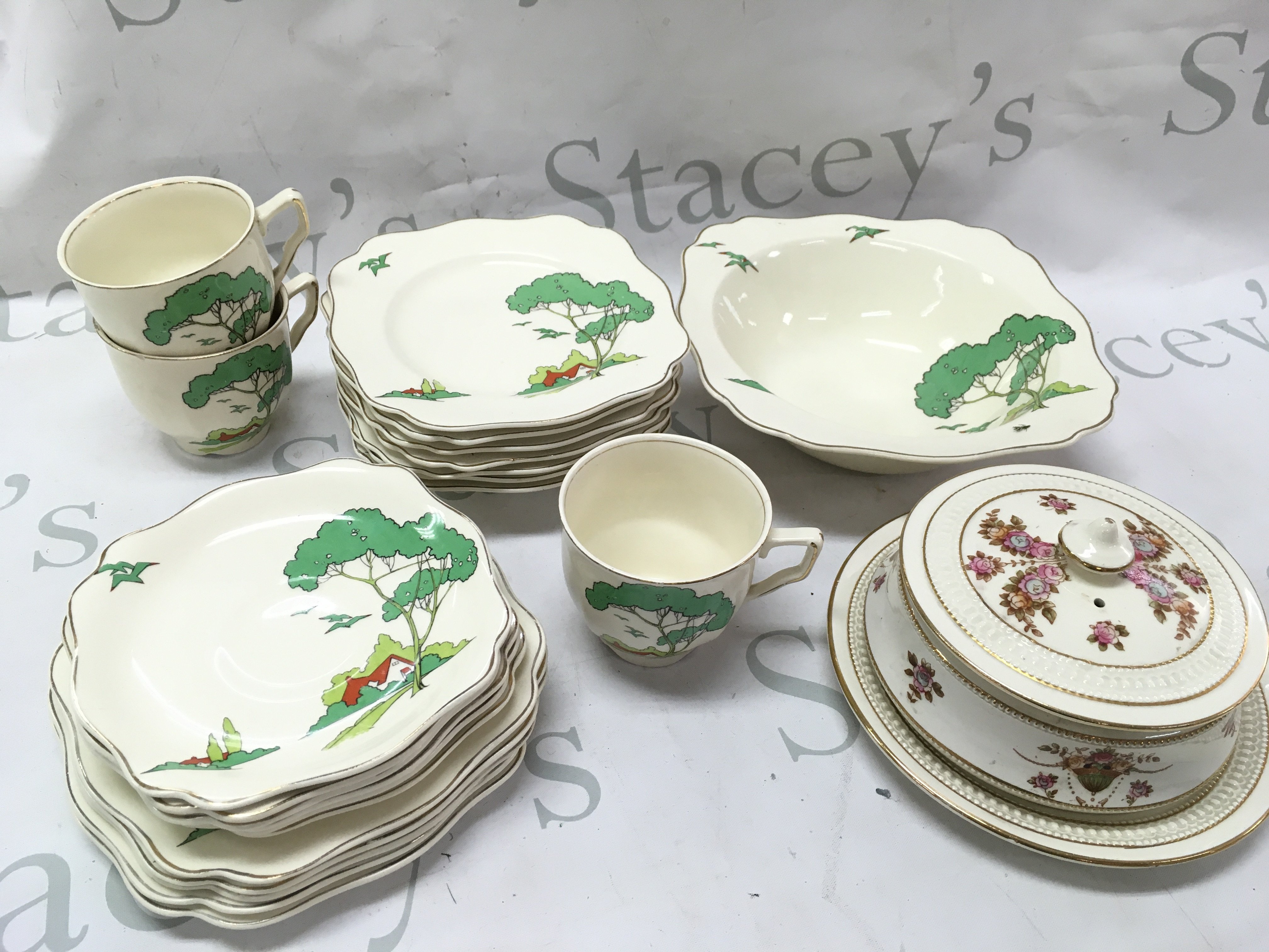 A Clarice cliff Snow White style tea set including saucers , cups, bowl dish and a Crown Devon jar. This lot cannot be posted