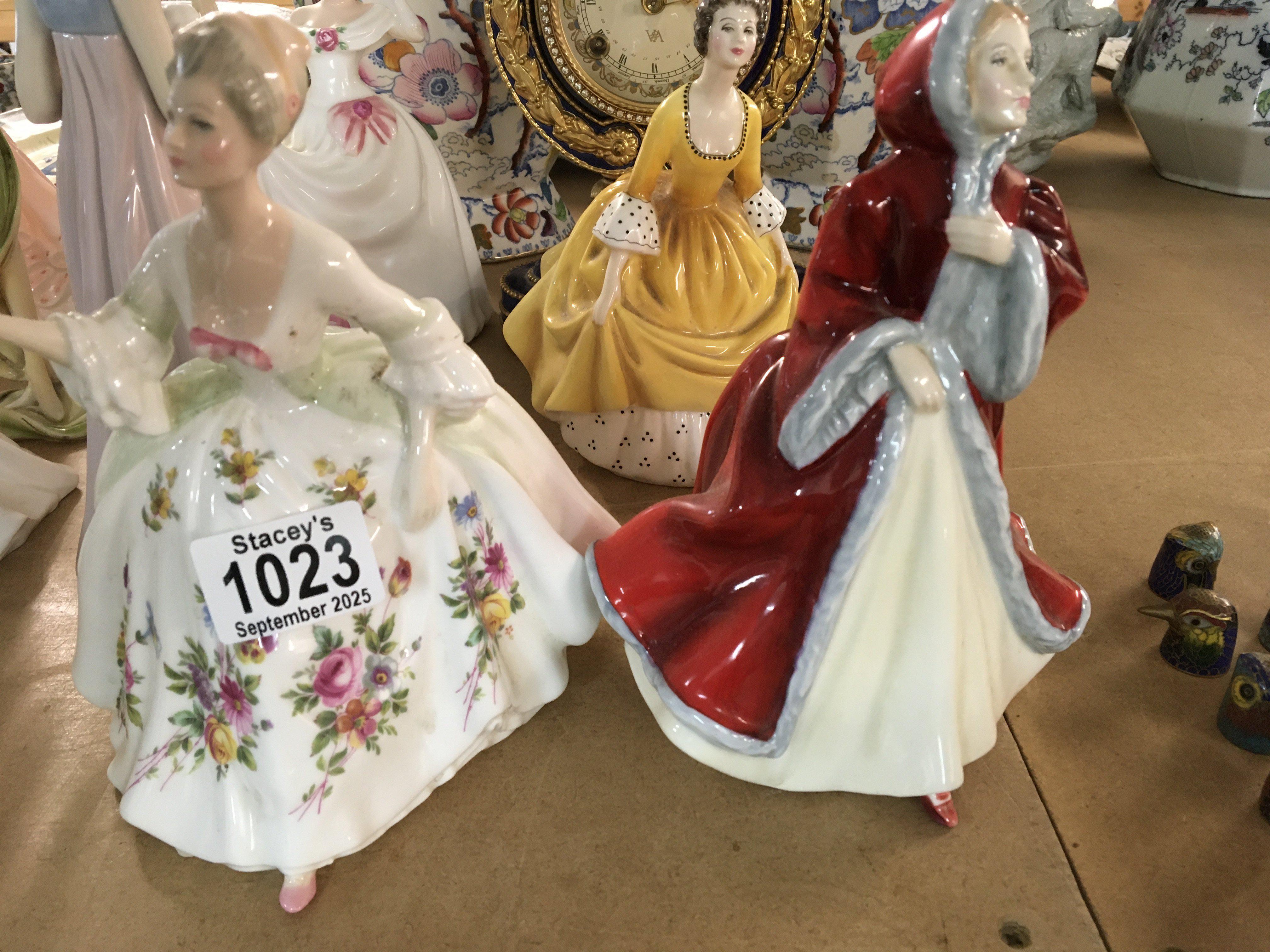 Three Royal Doulton figures .