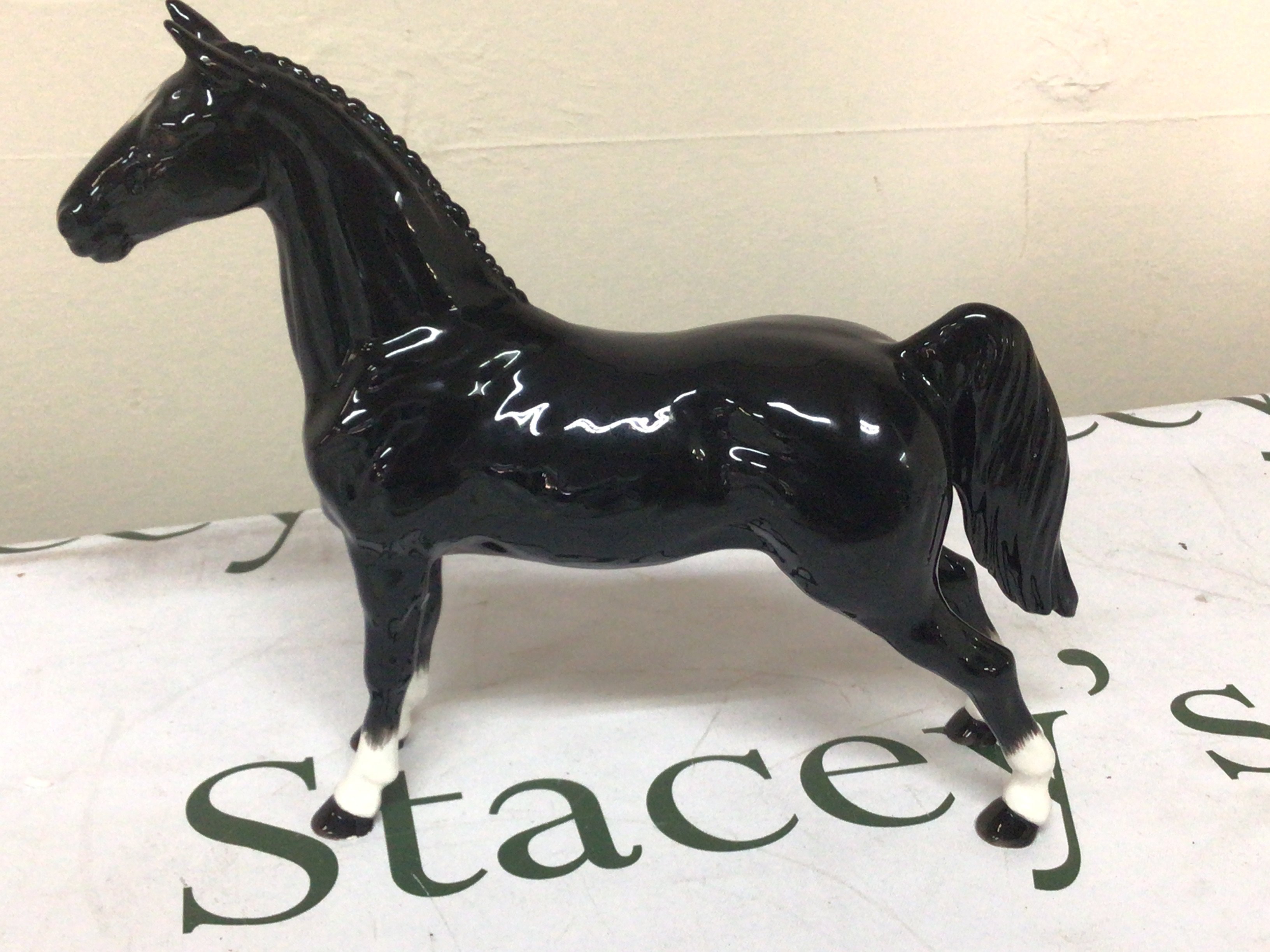 A limited edition John Beswick model of a black stallion with four white socks. No obvious damage or restoration.