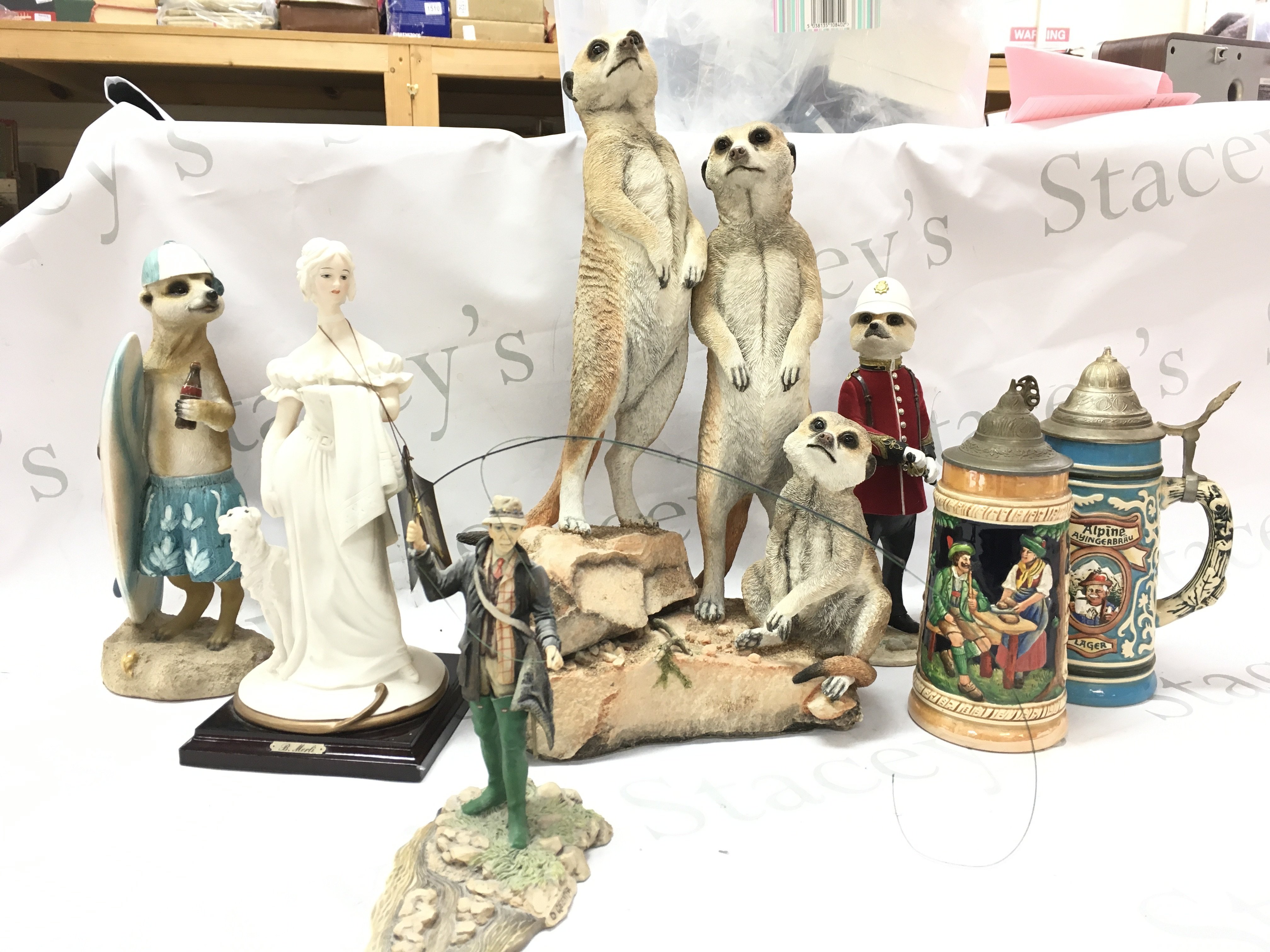 Meerkat Country Artists resin figures, Bruno Merli figure, german porcelain tankards. This lot cannot be posted