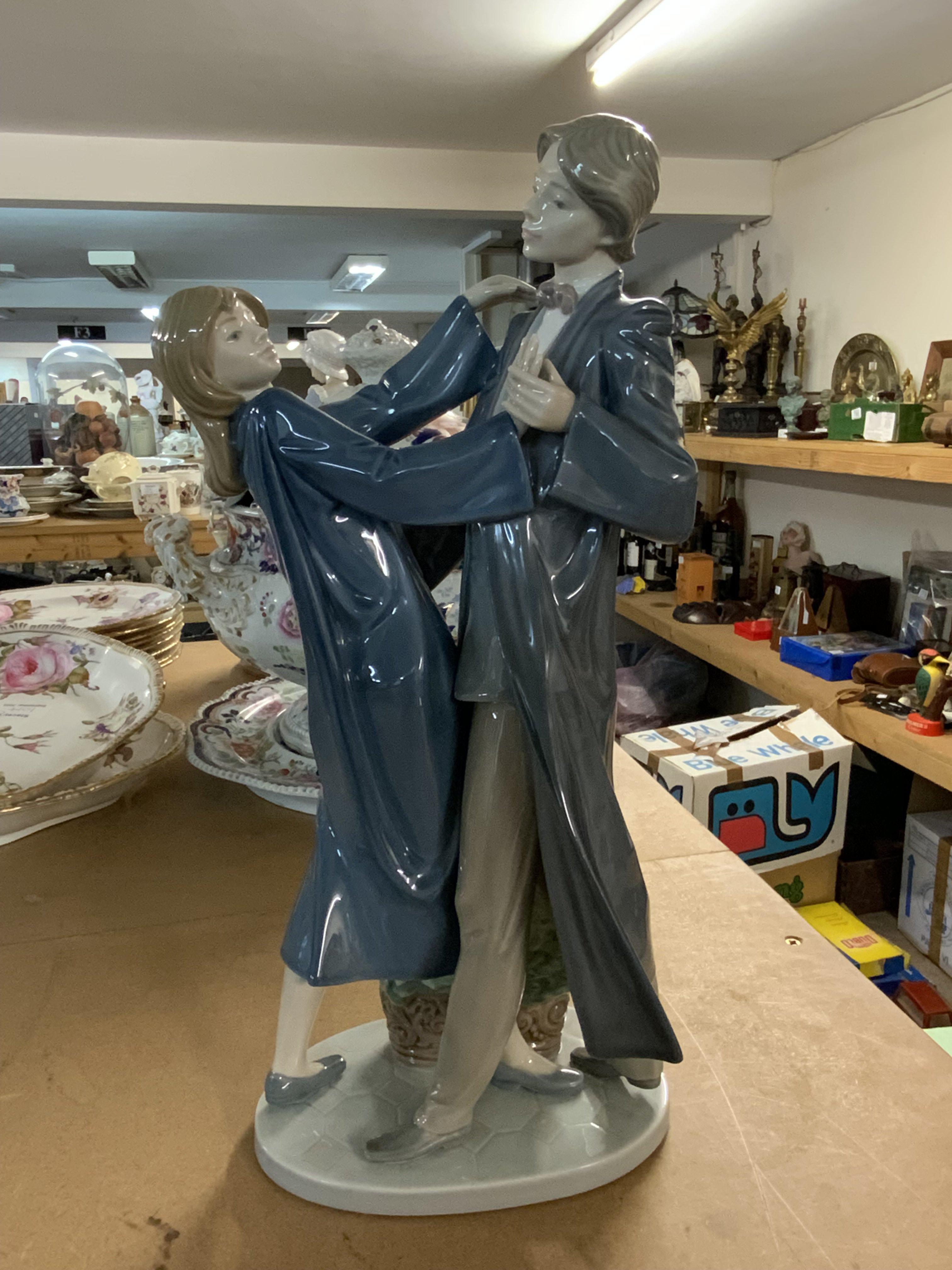 A large Lladro porcelain figure. Graduation Dance.
