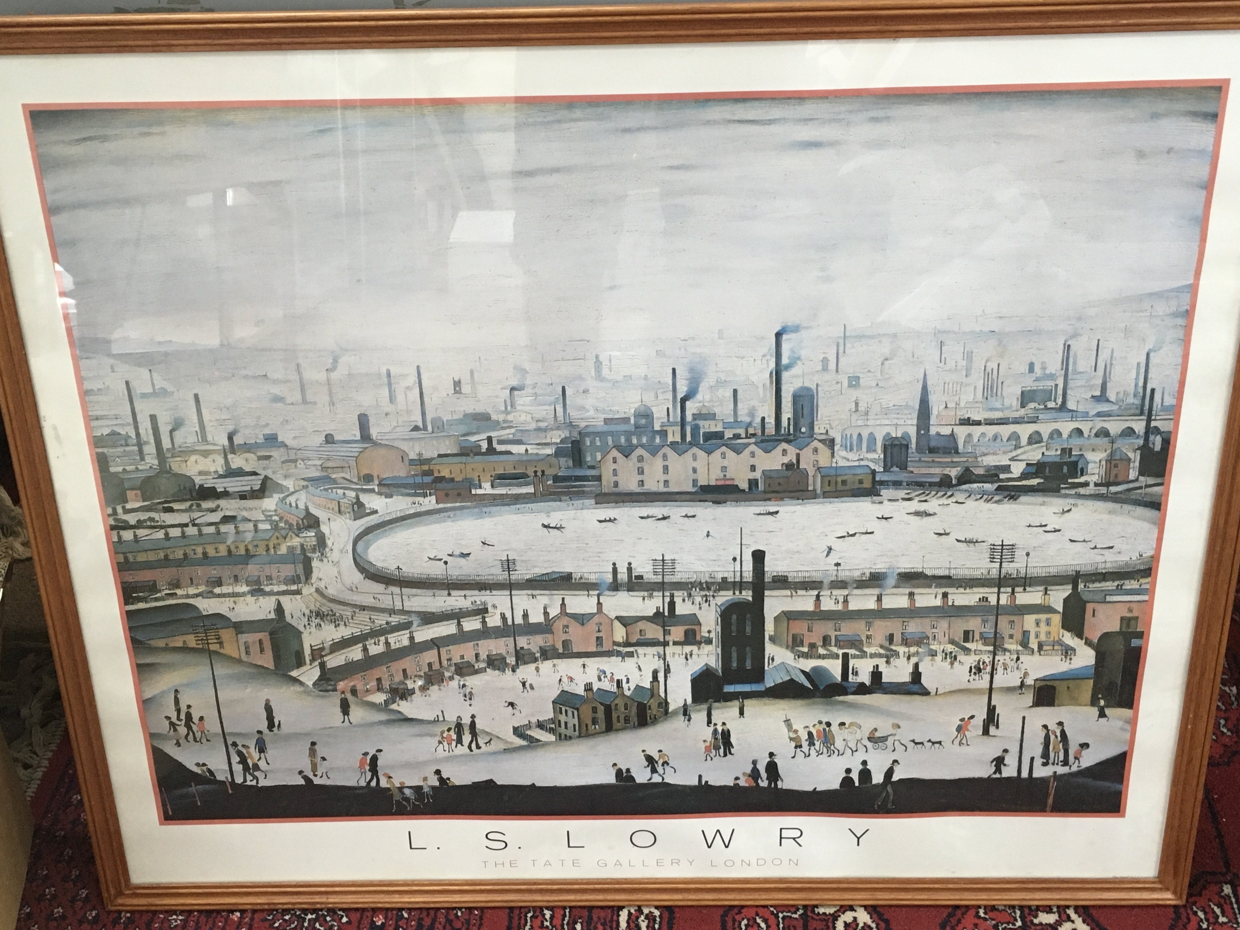 A framed L. S. Lowry - The Pond print. Frame dimensions 78cmx64cm
