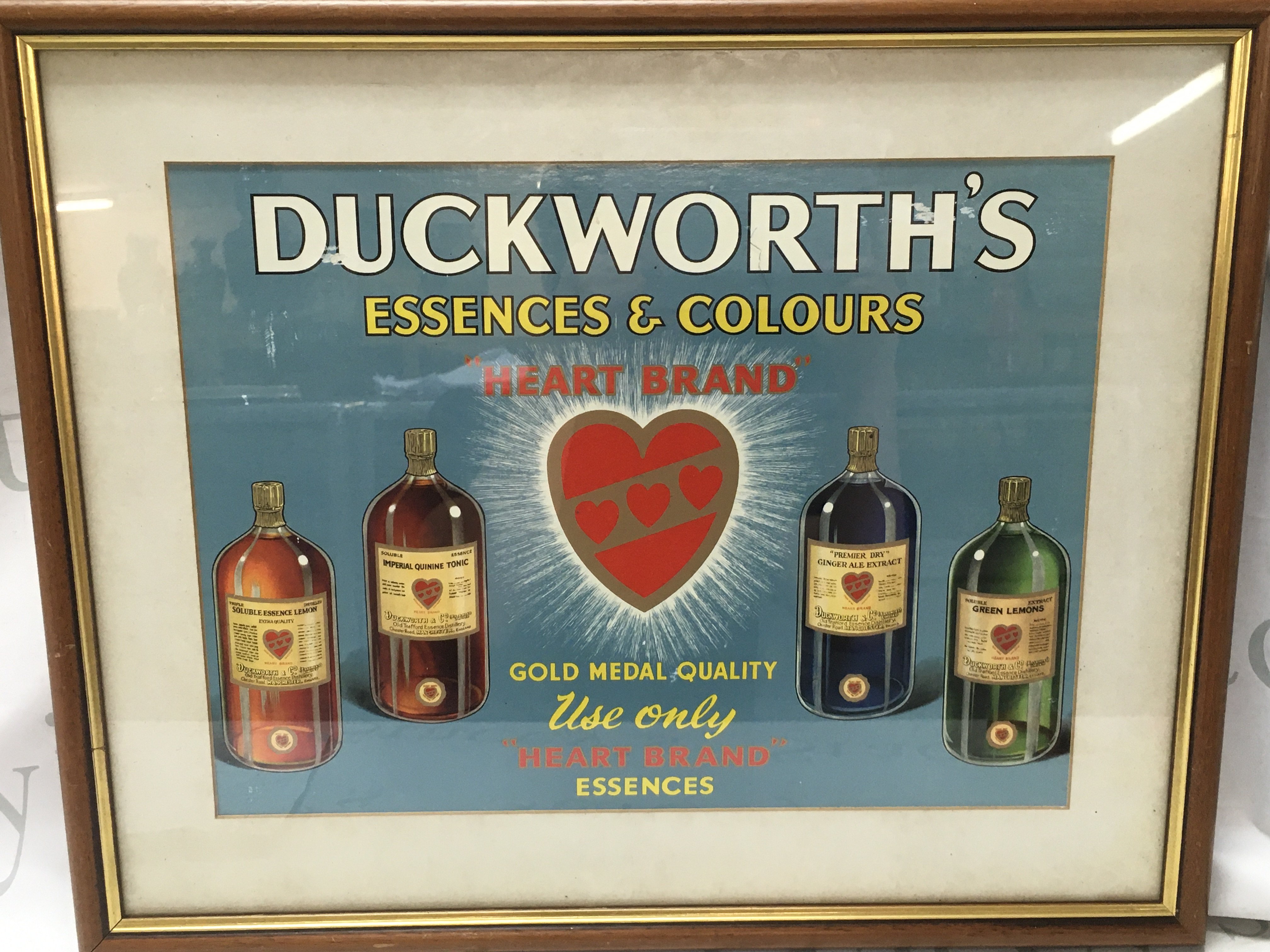 A framed advertisement for Ducksworth esscences and colours . Frame dimensions 54x44cm. This lot cannot be posted