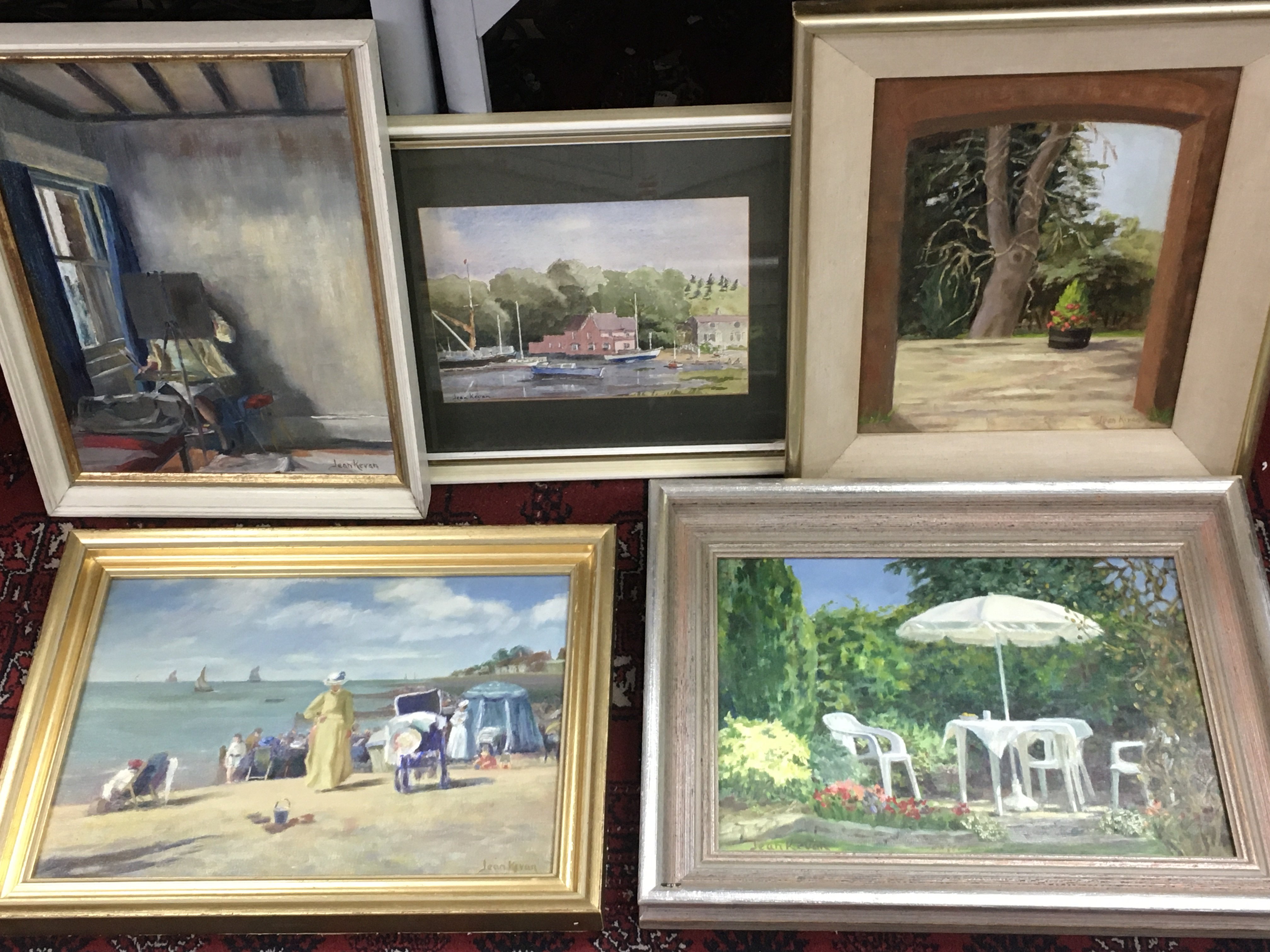 Four framed Jean Kevan (1916-2006) oil paintings and a Watercolour . My Favourite Corner Jeans Garden in Leigh-on-Sea, Imagined day on the beach at Westcliff-on-Sea in the 1880s Etc.