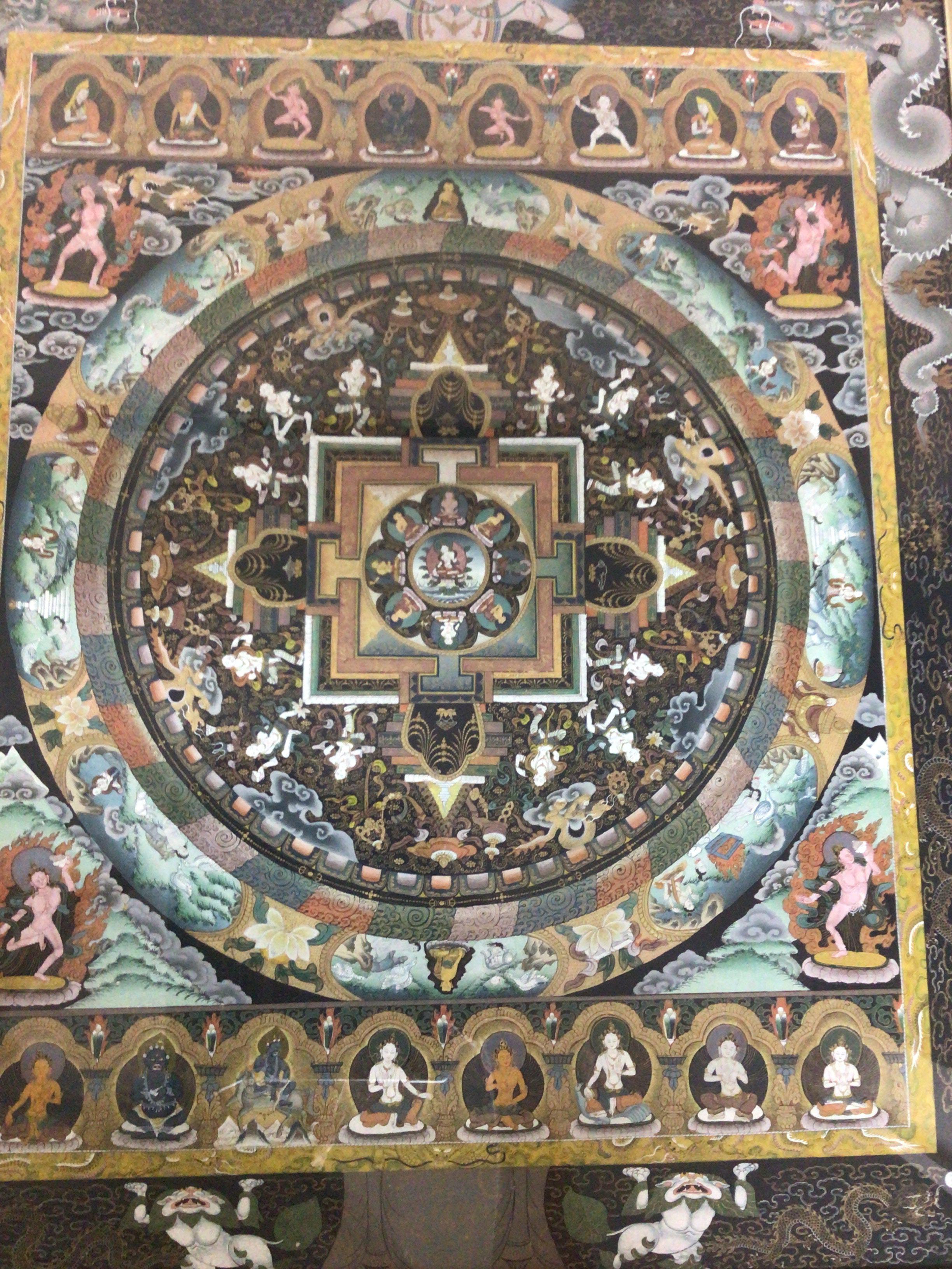 A framed Tibetan Mandela in a walnut frame 65x78cm