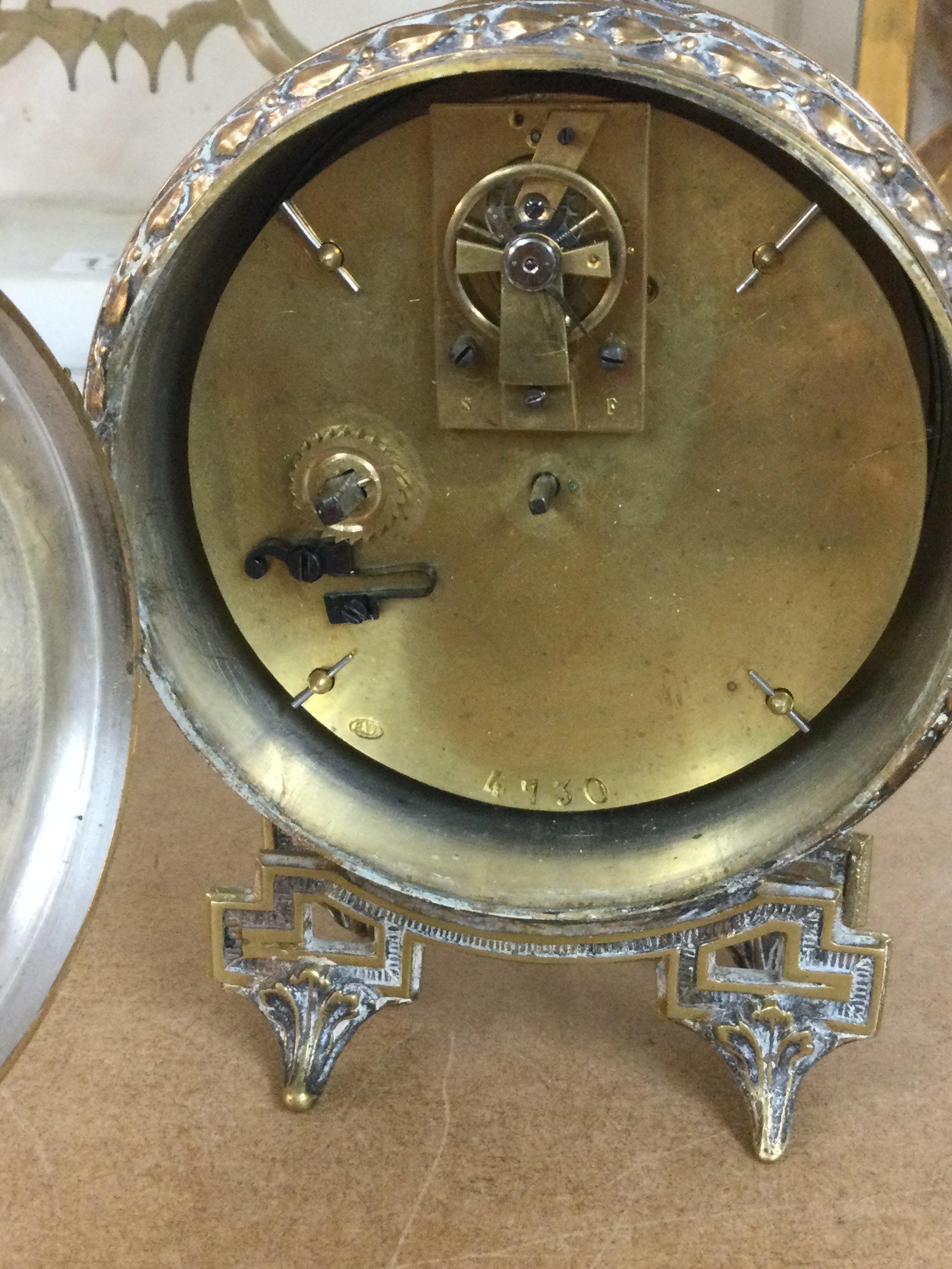 A French bedside clock the enamel dial with Roman numerals.- NO RESERVE