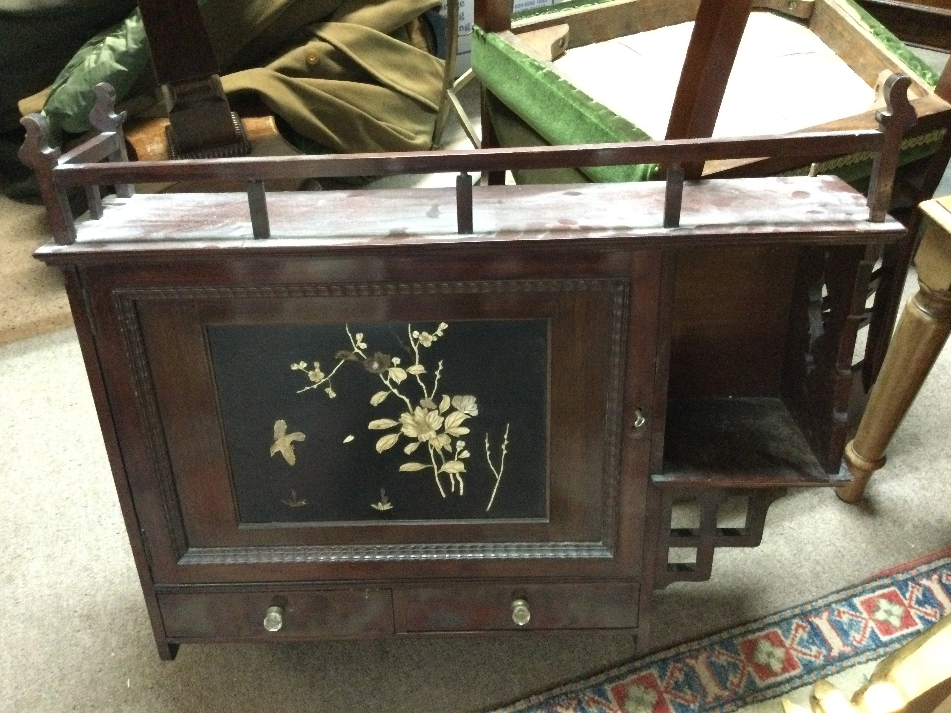 An oriental style wall cabinet with mother of pearl inlay 75cm wide 66cm tall approximately
