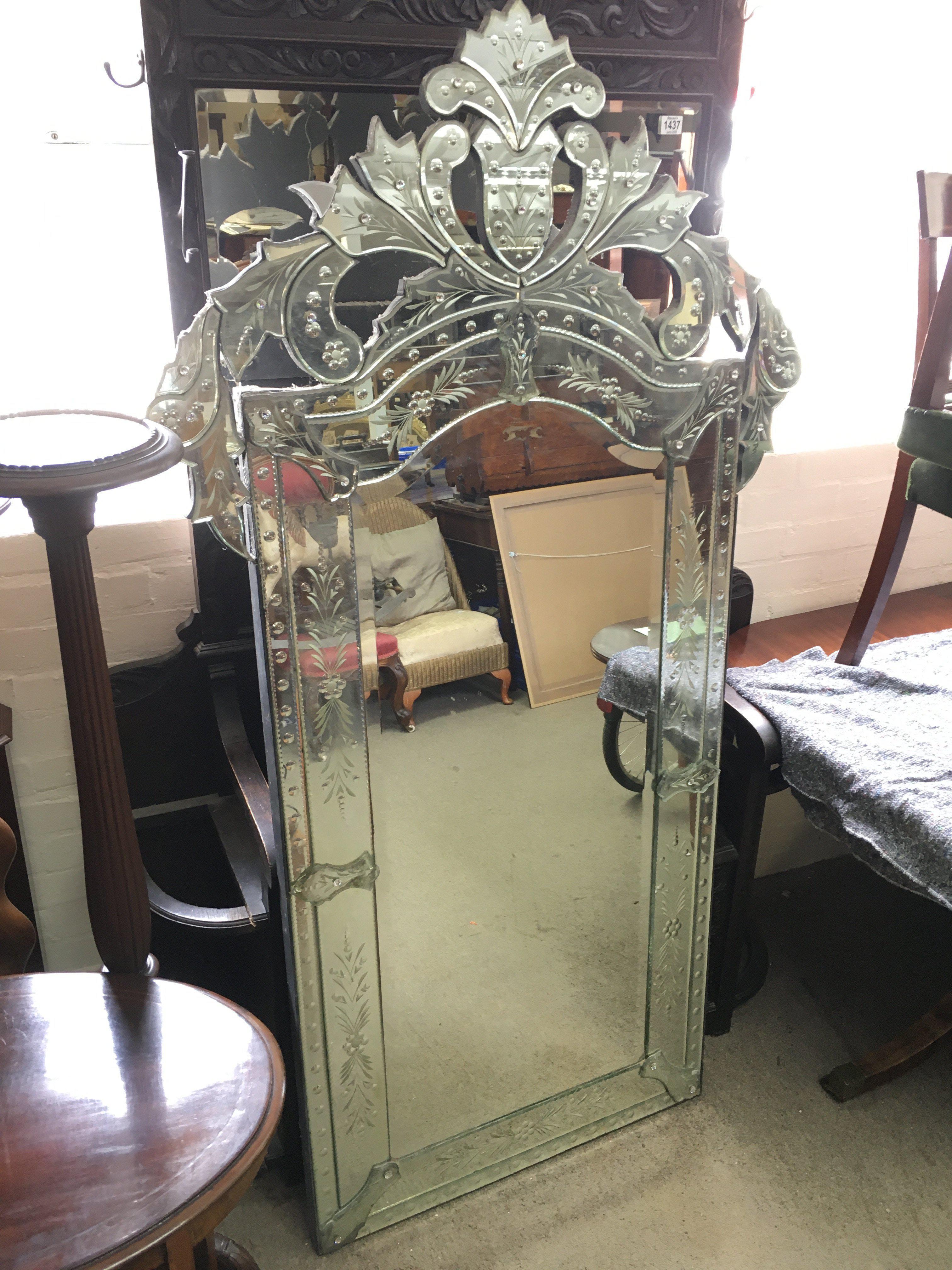 A large Venetian mirror , dimensions 97cm wide 179cm tall