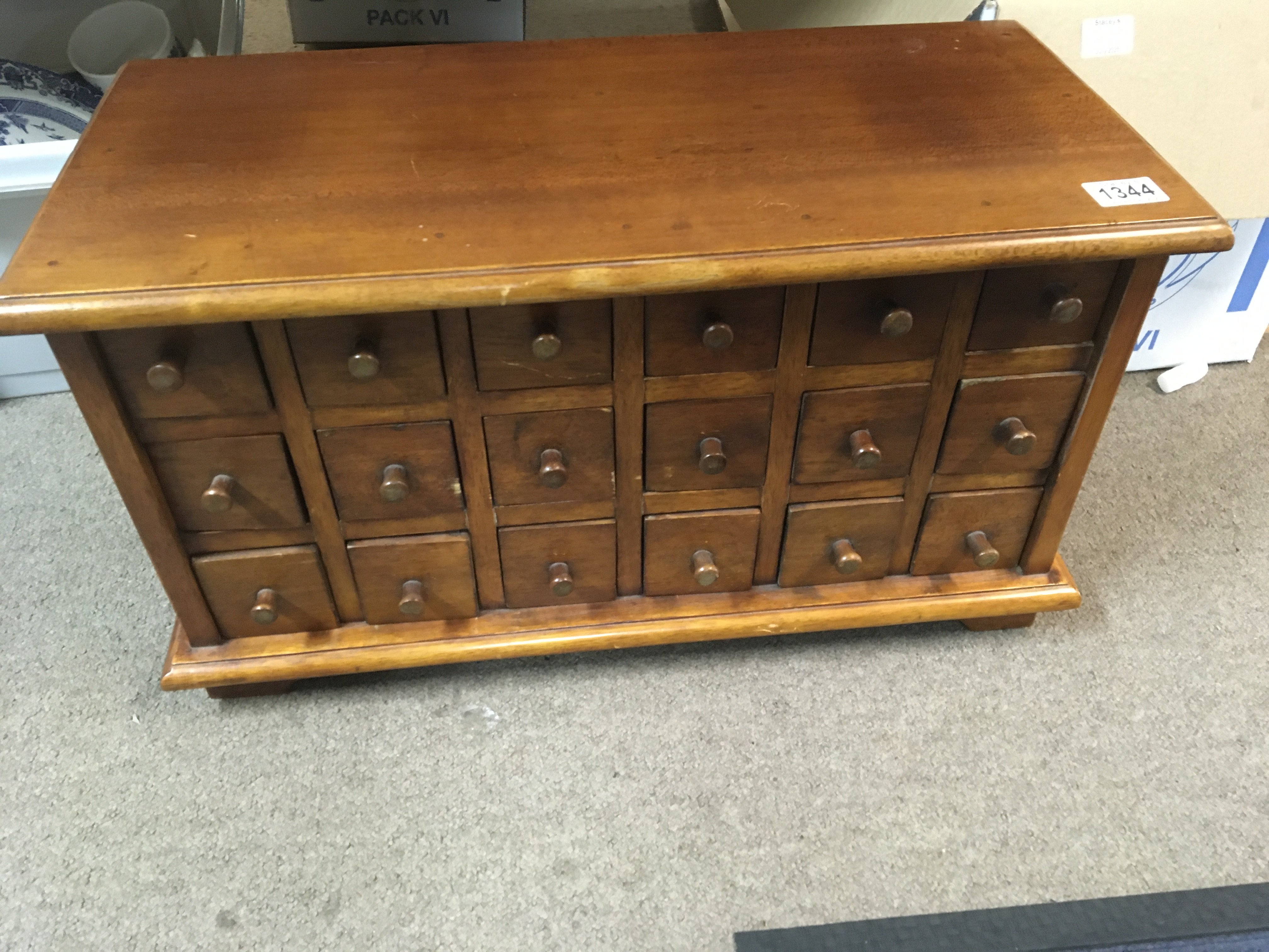 A small mahogany collectors cabinet fitted with 18 drawers.