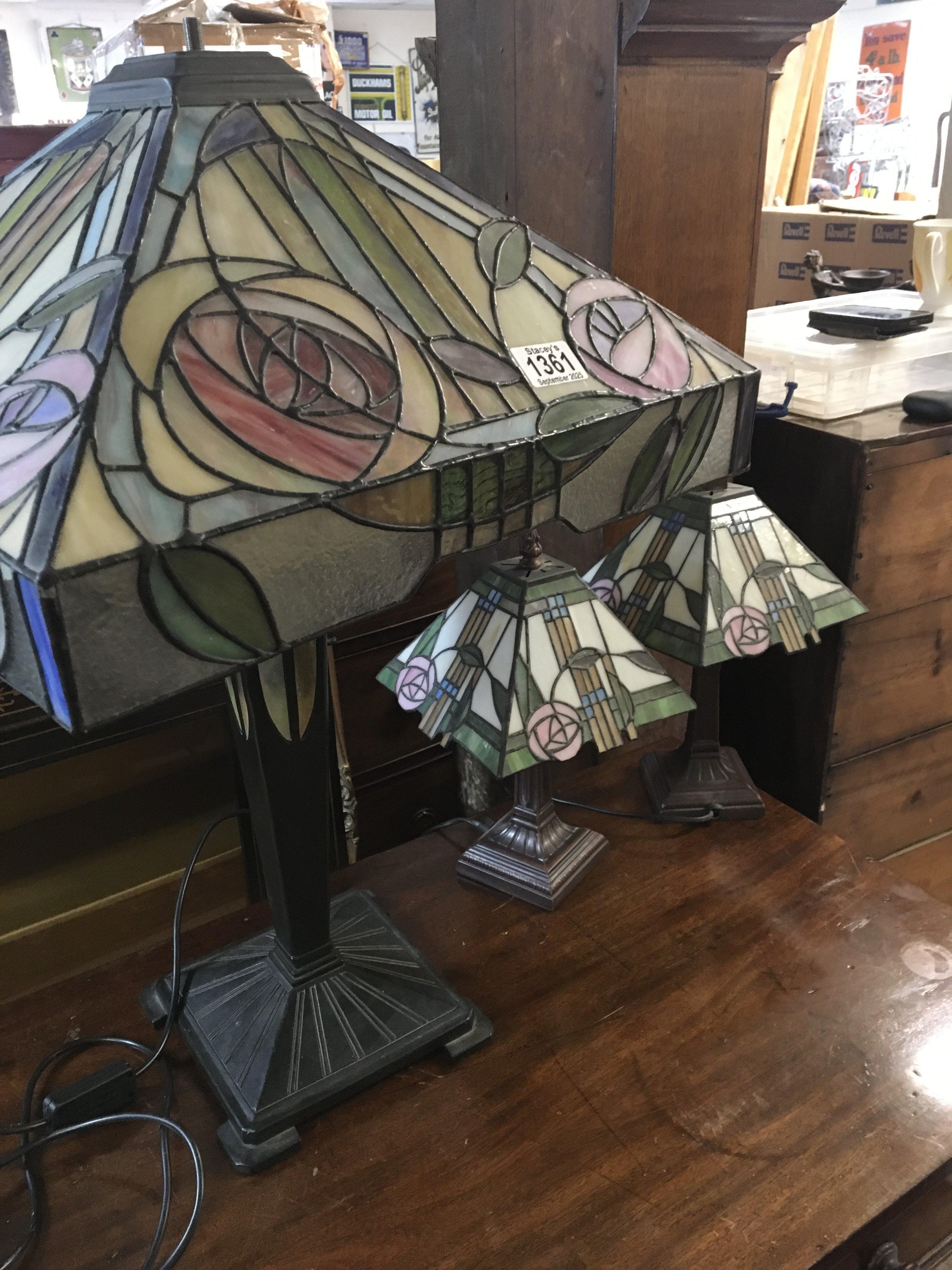 Three Tiffany style lamps .