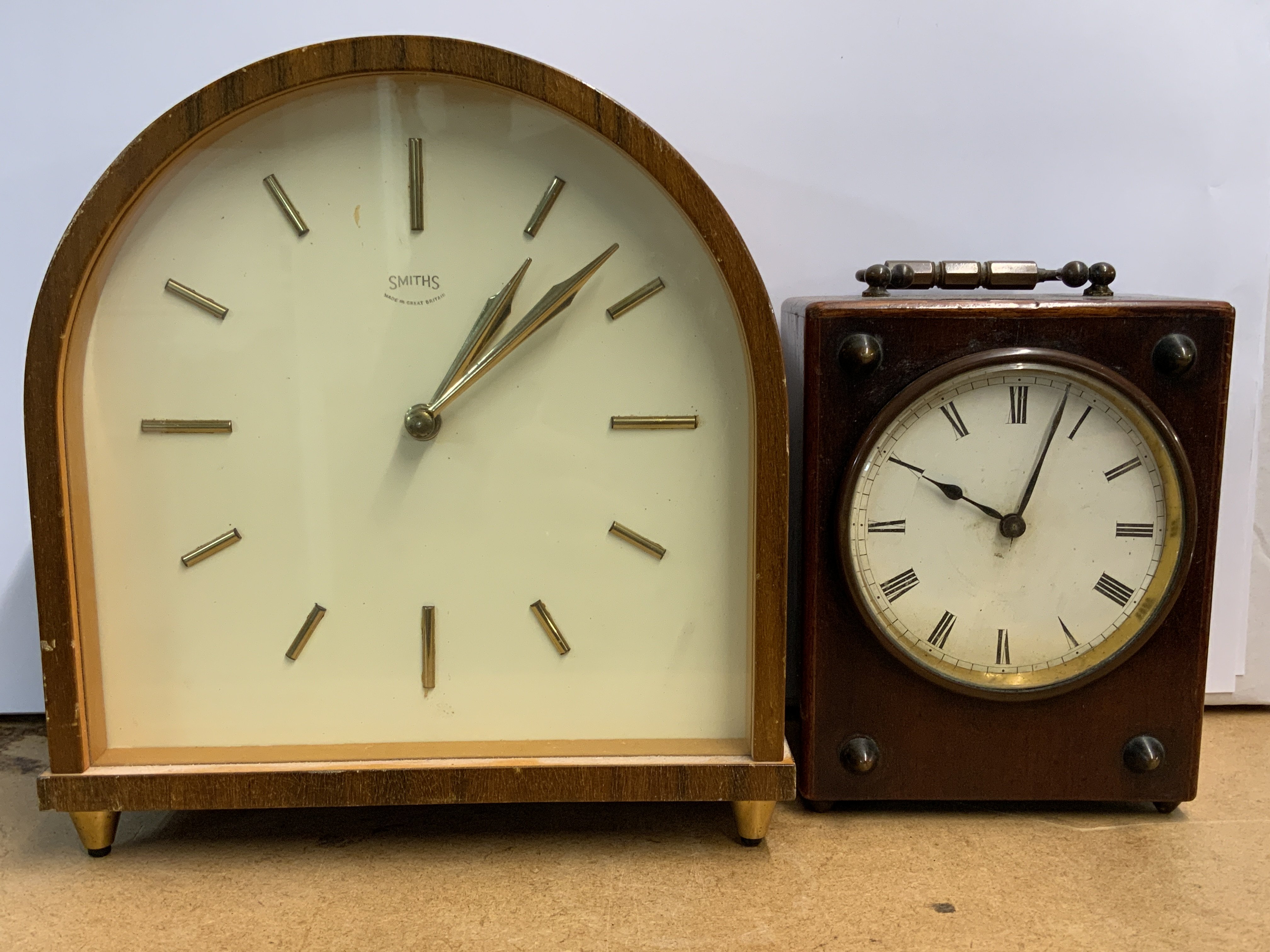 A vintage 1970s smiths mantle clock together with a small Victorian Officers clock.