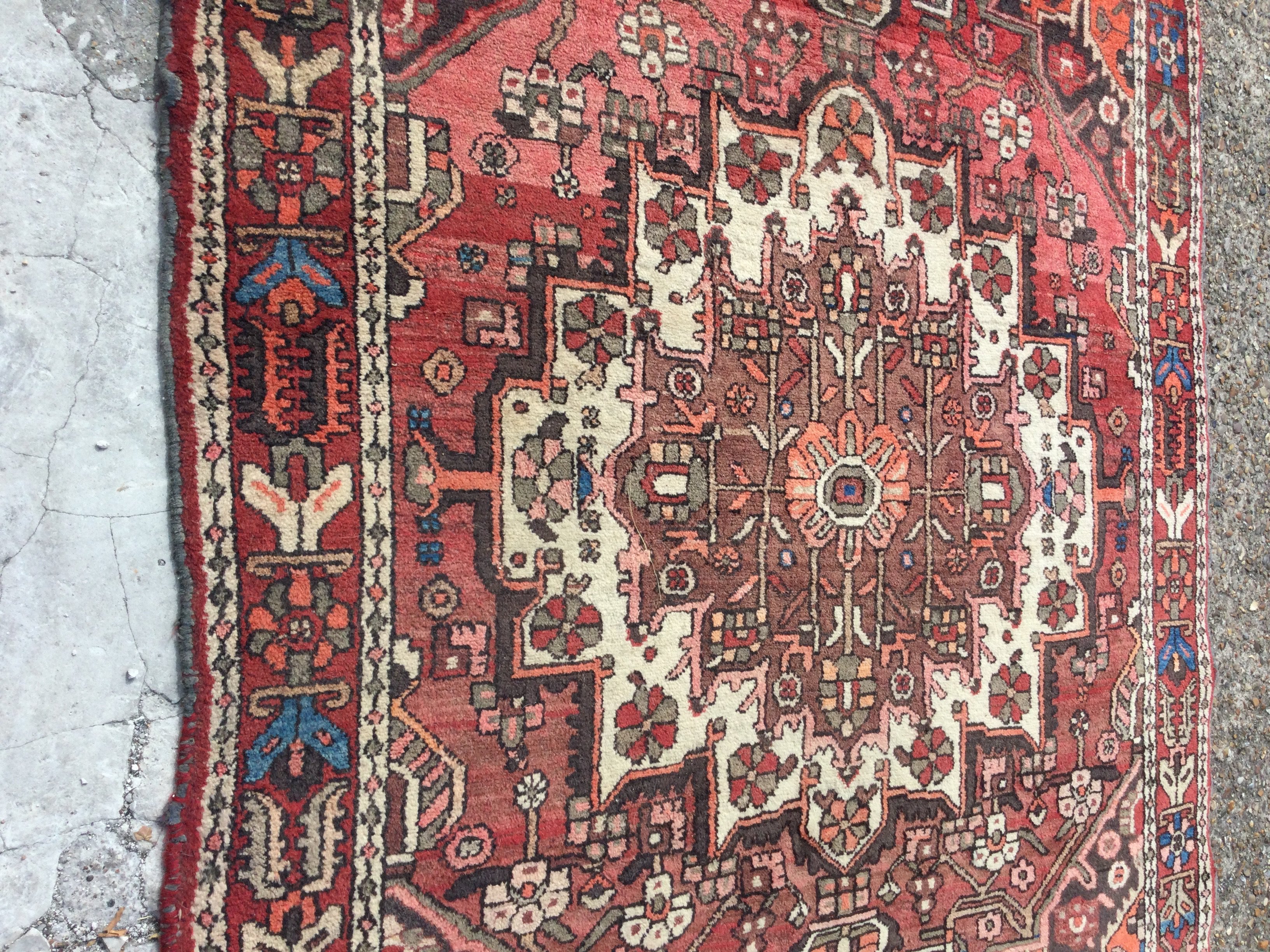 A Persian geometric rug on a red ground , 157 x 200 cm