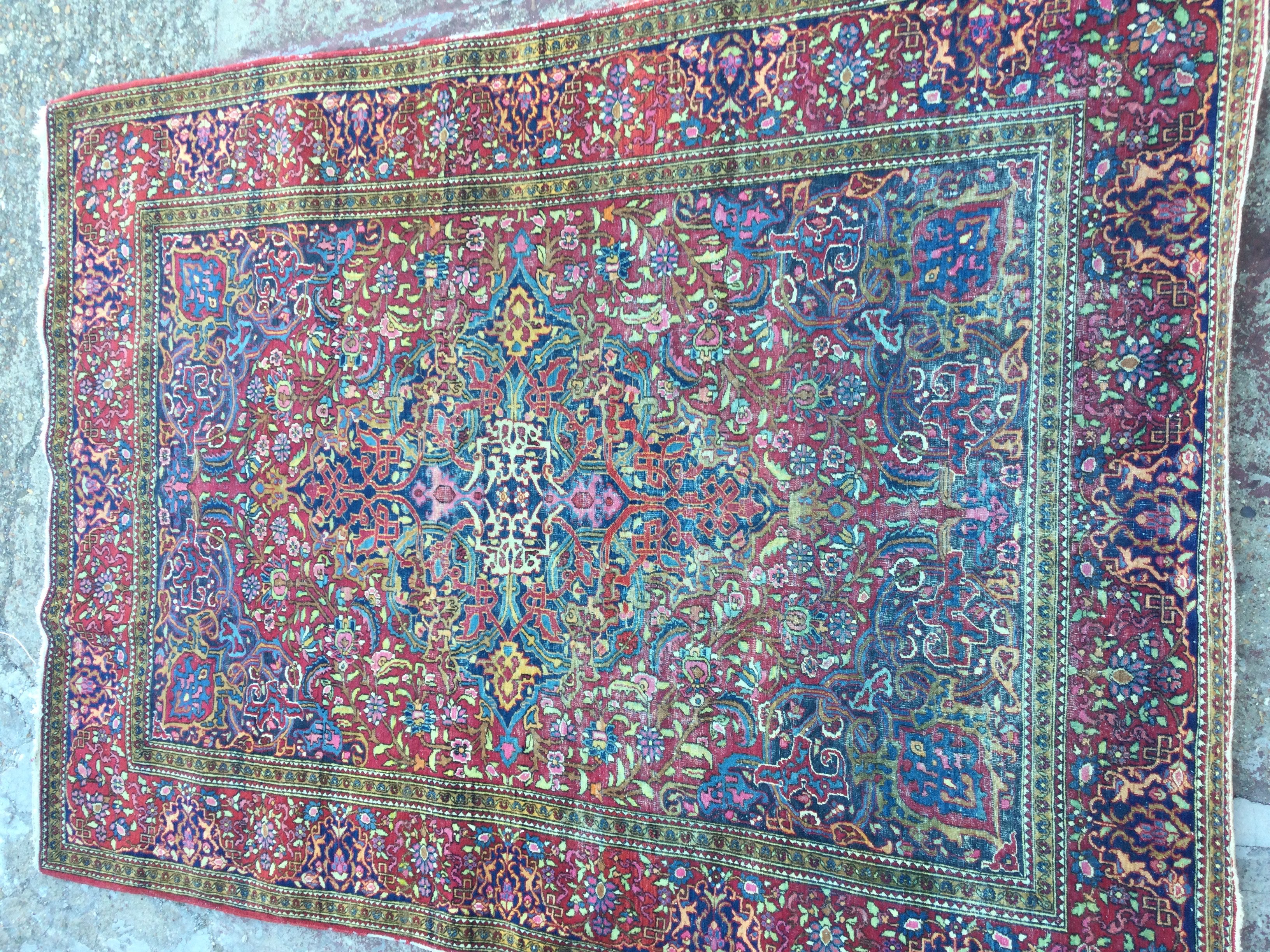 A. Persian rug with floral and geometric design. 195 x 135 cm .