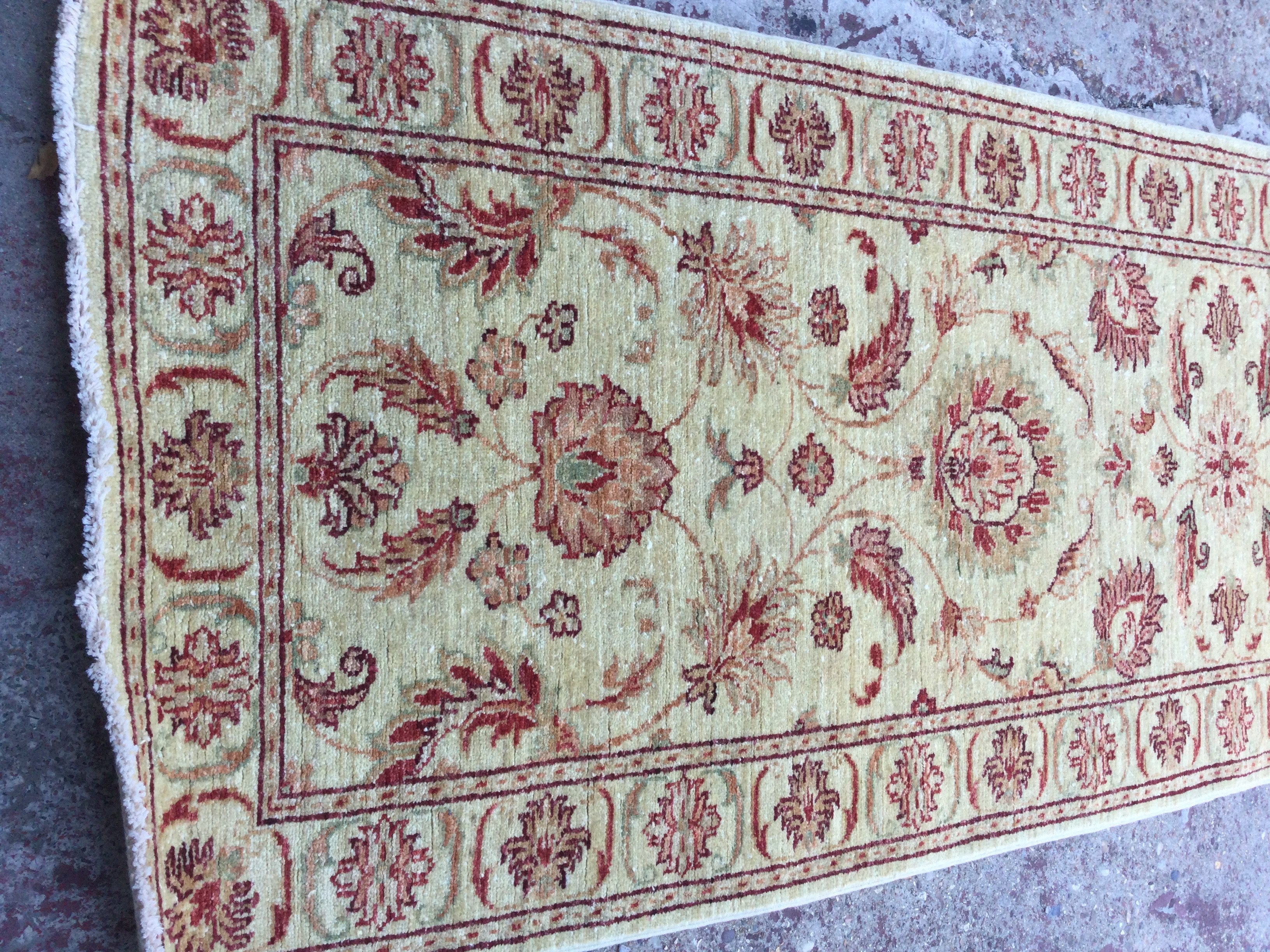 A Afghan floral design on ivory field runner 245 x 80 cm .