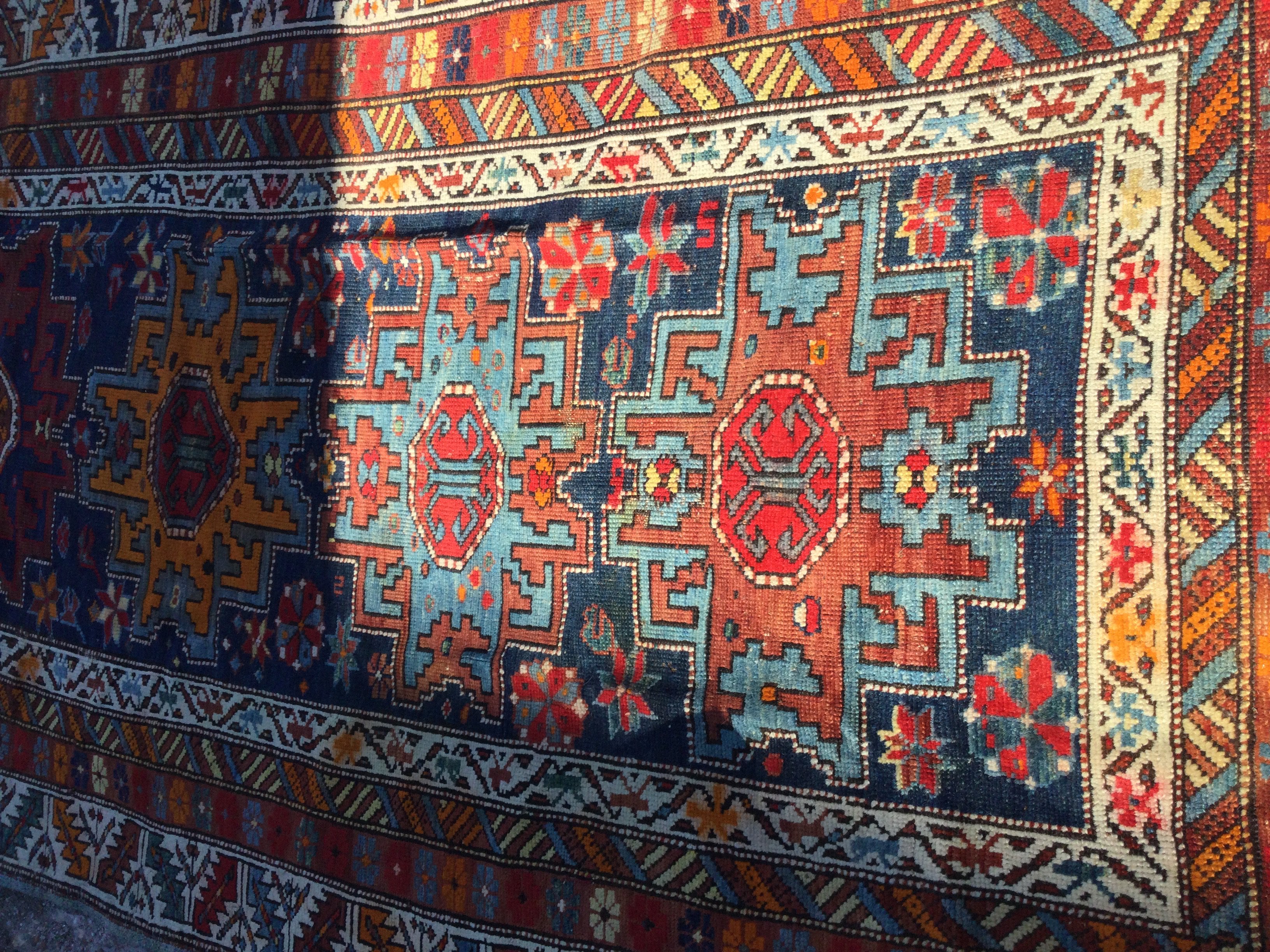 A Persian geometric pattern runner with repeat pattern boarders.
