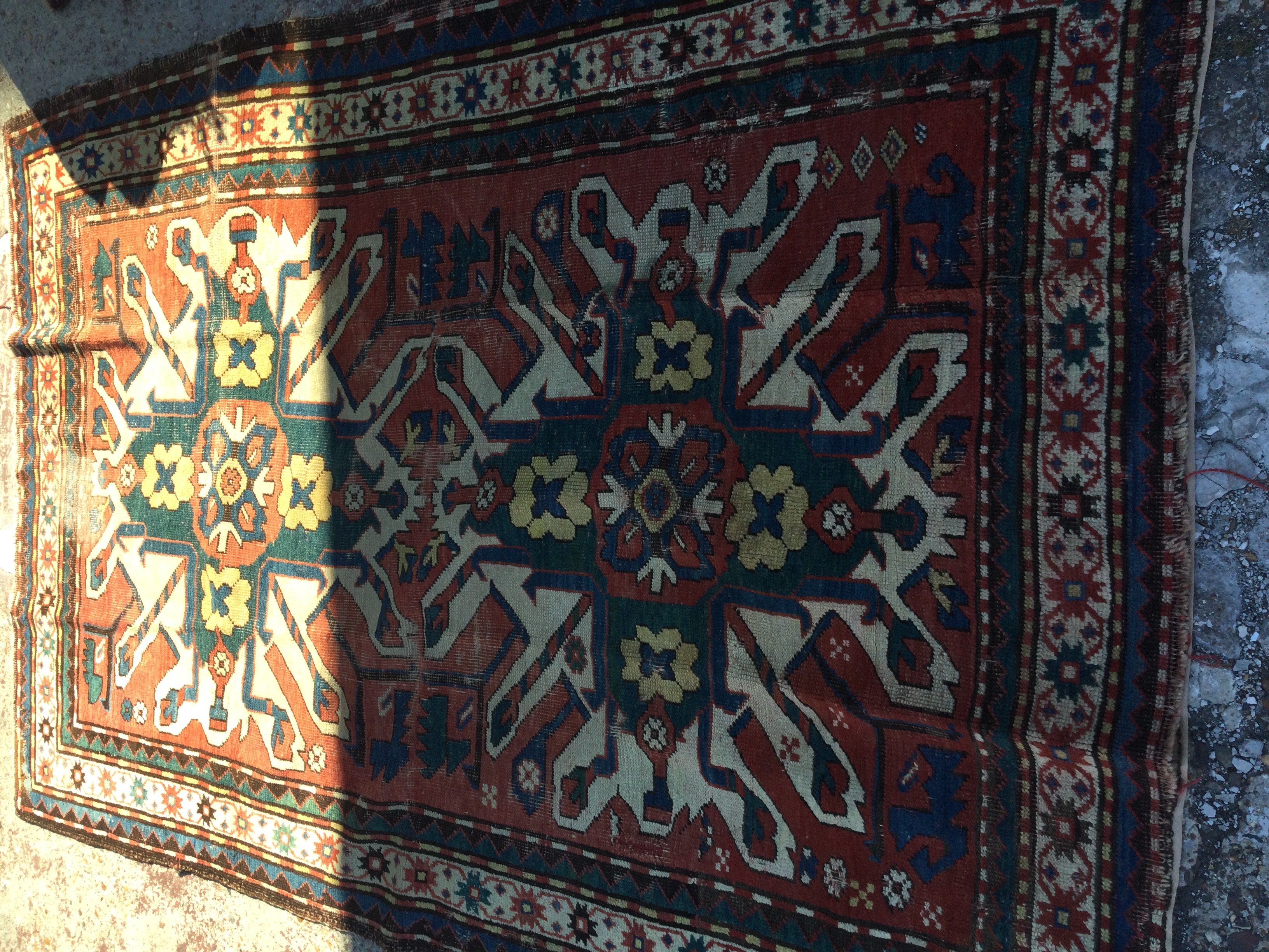 A Kazak rug the centre with geometric design. 185 x125 cm .