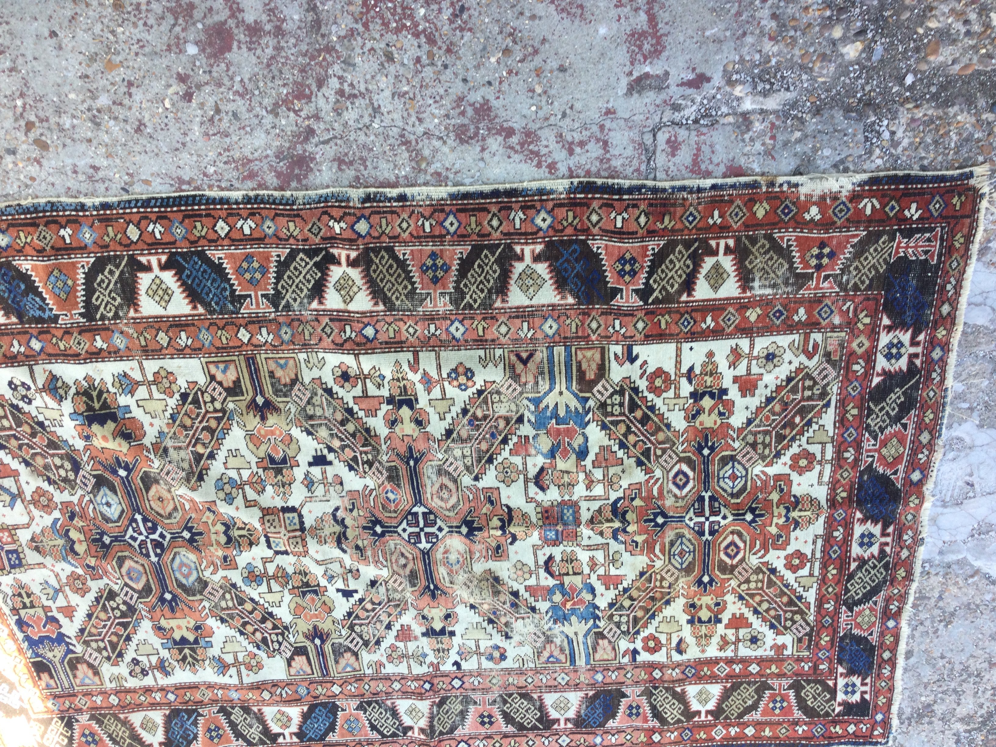 A Persian rug with central geometric pattern. 150 x 118 cm .