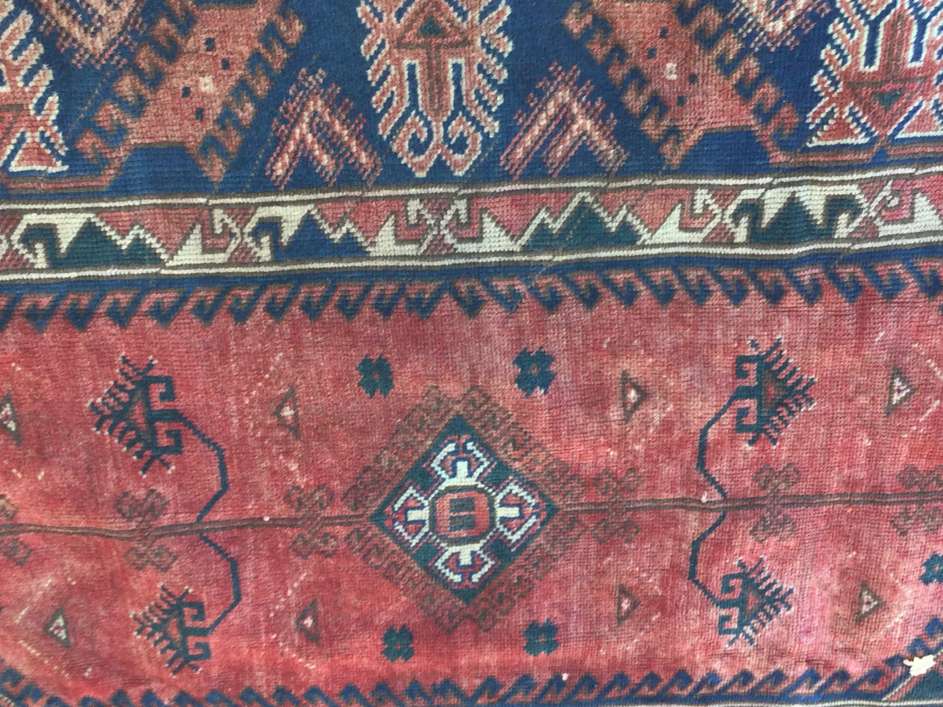 A Persian rug with geometric centre and boarder .190 x220 cm .