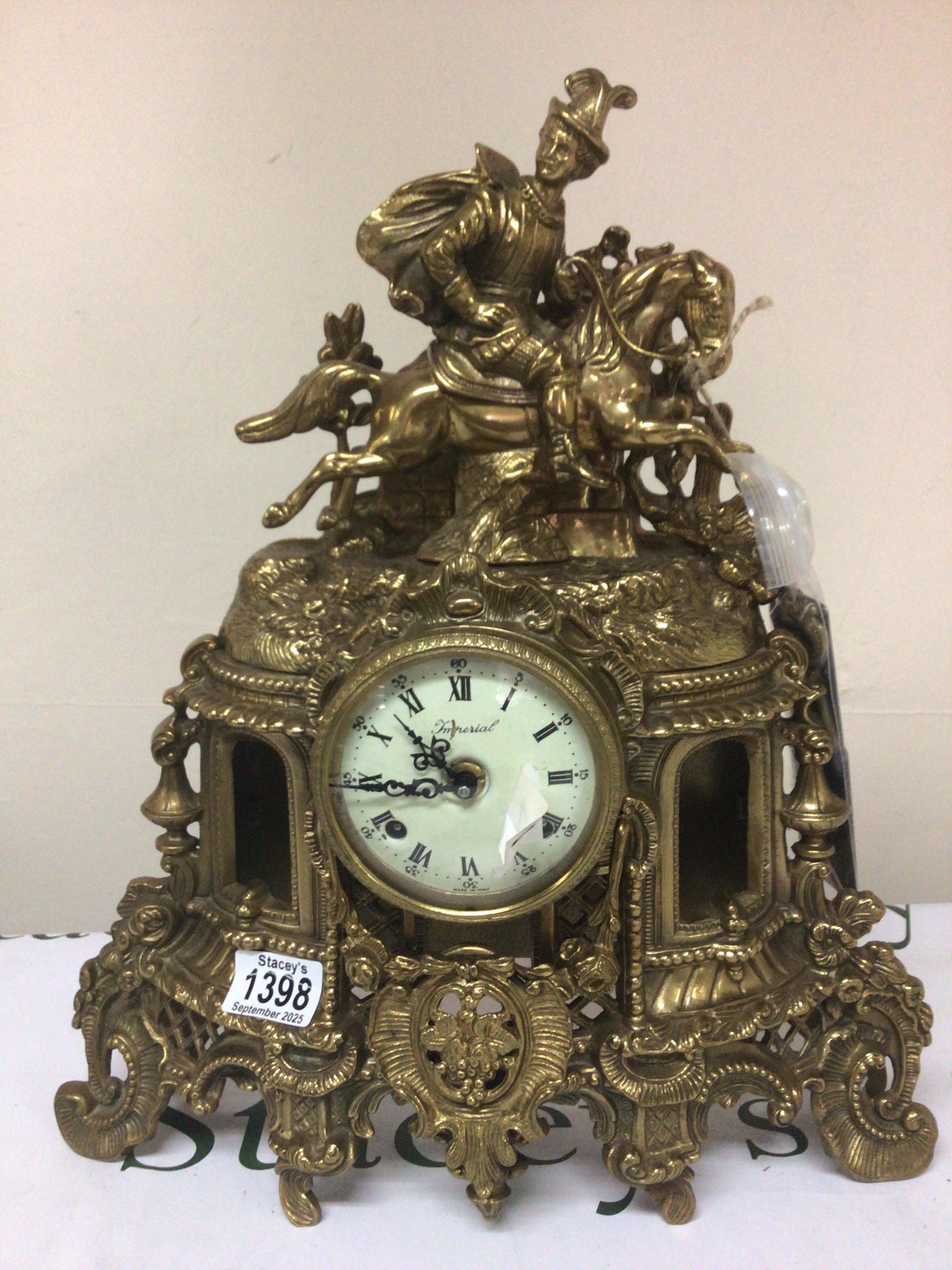 A brass cased Italian clock Imperial the case surmounted with a figure on a horse has key height 44cm.