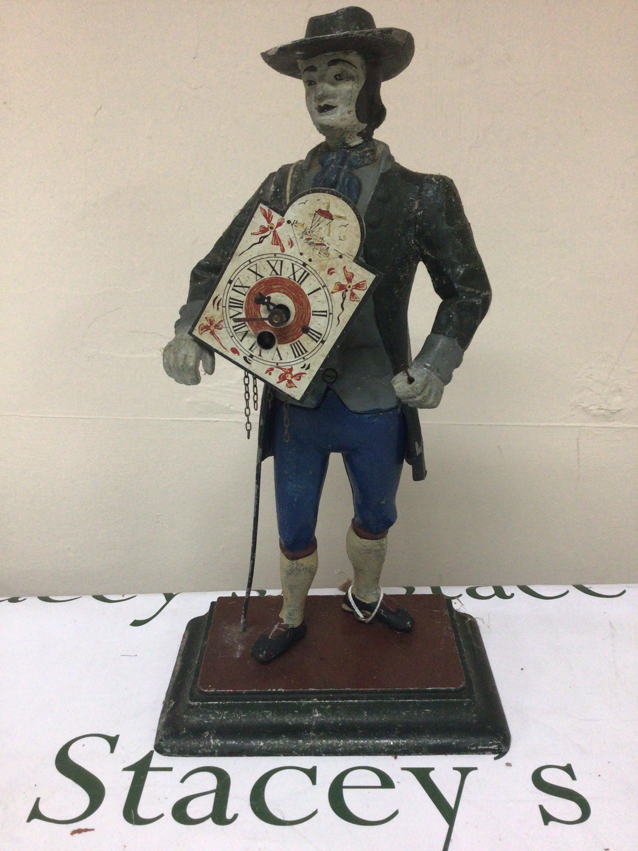 A Continental painted metal clock the peddler clock Height 40cm
