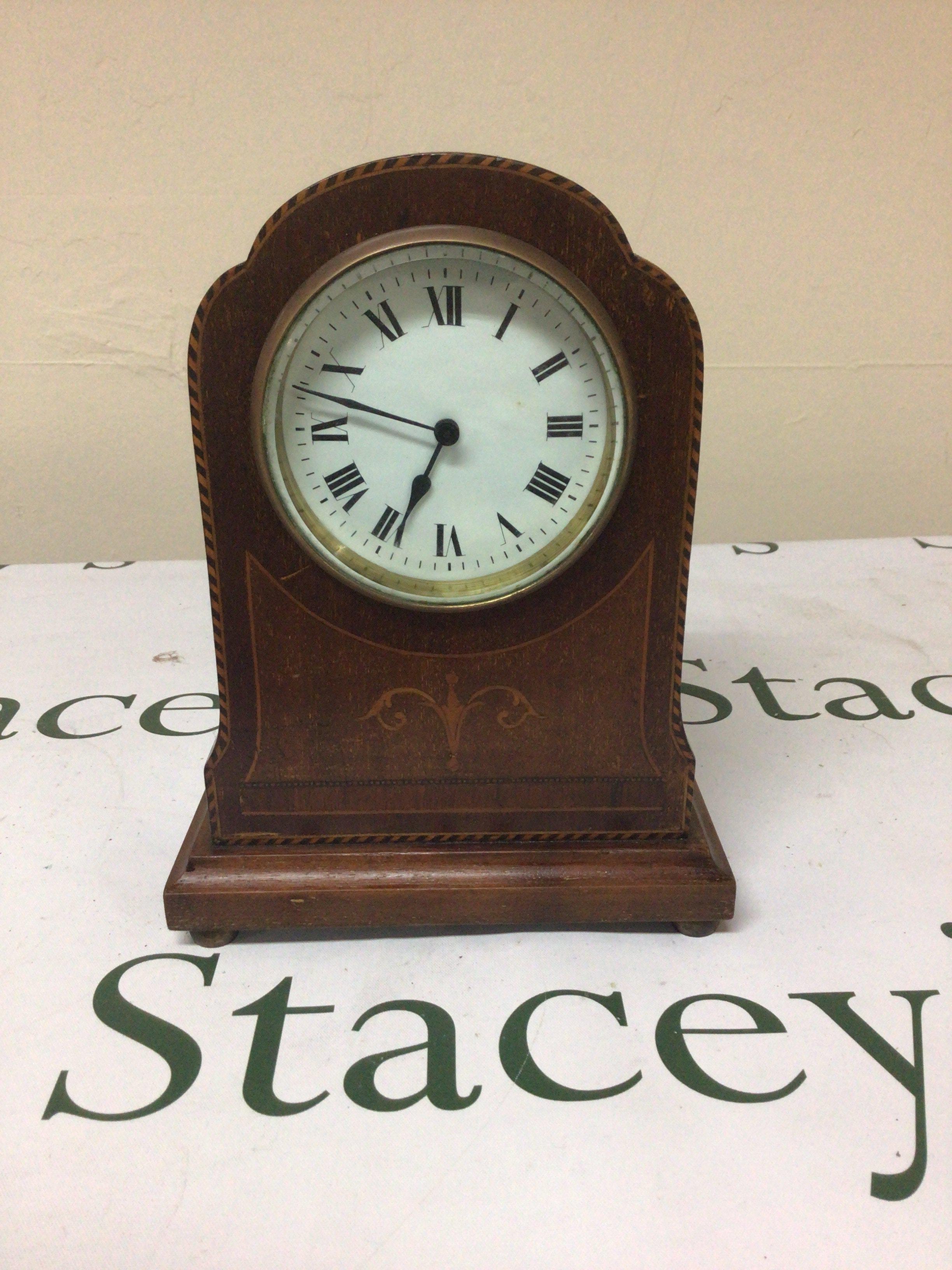 An Edwardian inlaid Mahogany mantel clock with a white enamel dial height 22cm