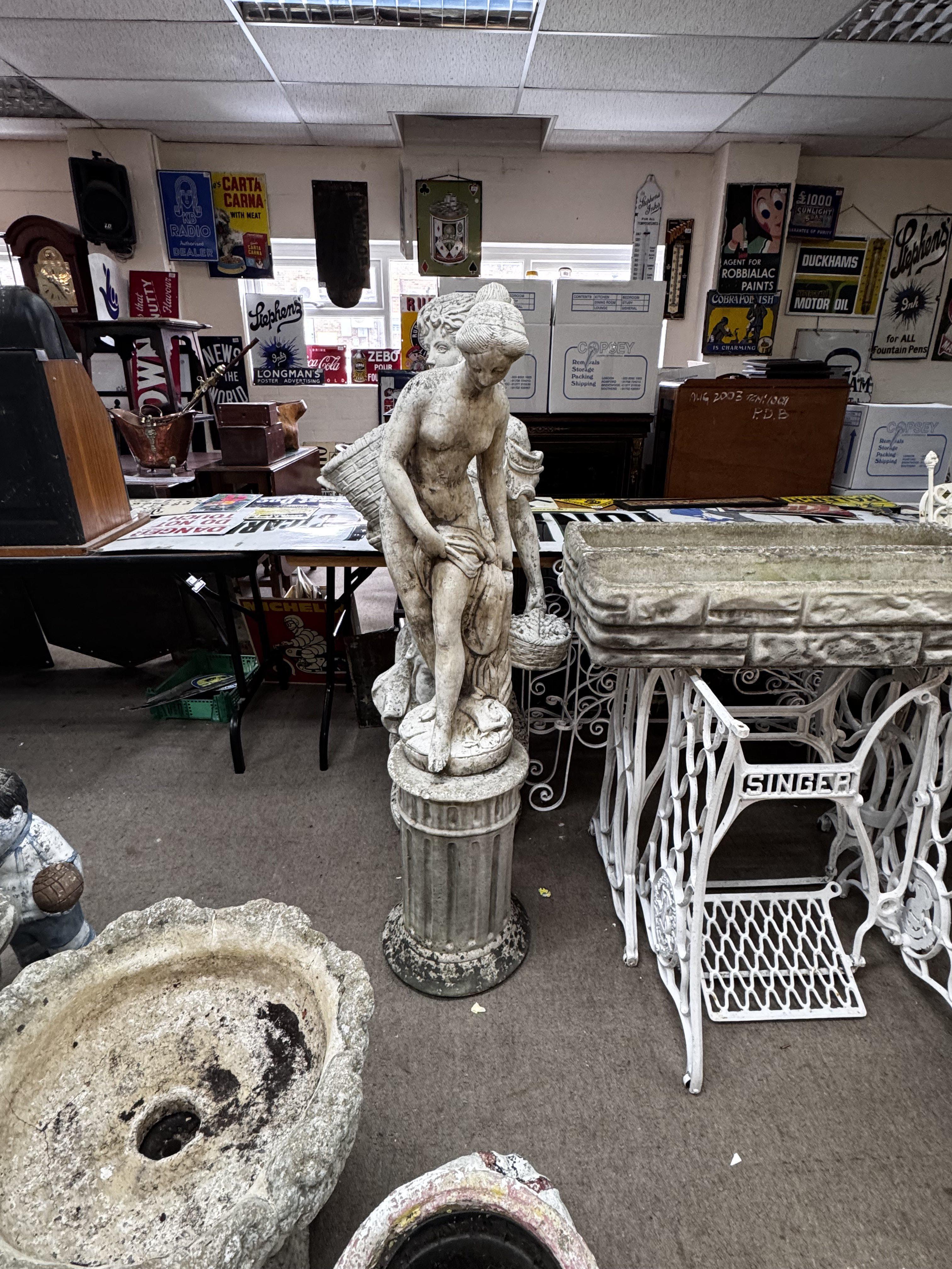 A cast concrete figure of a nude maiden, together with a plinth. Overall height. 131cm.