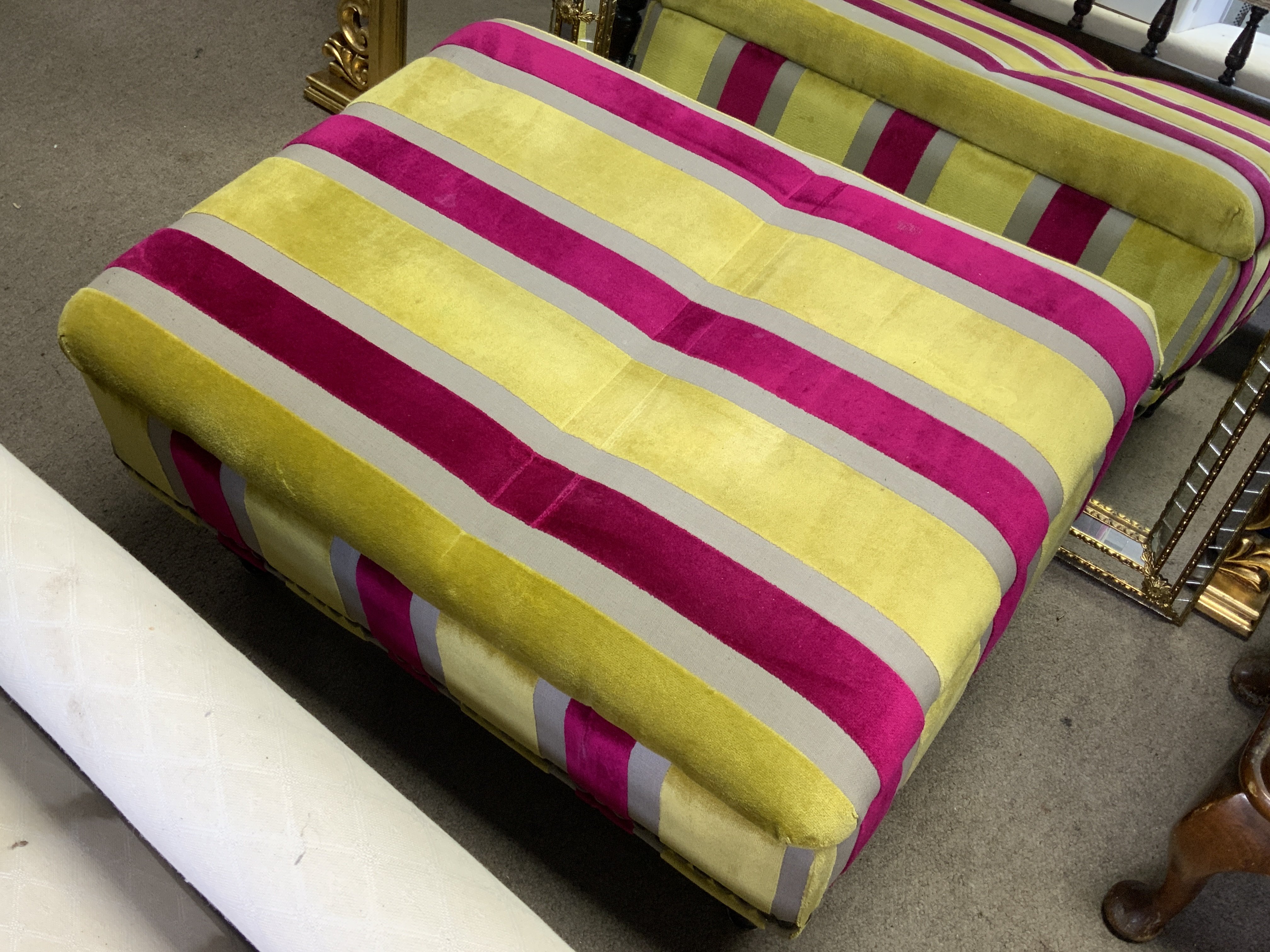 A modern upholstered footstool.