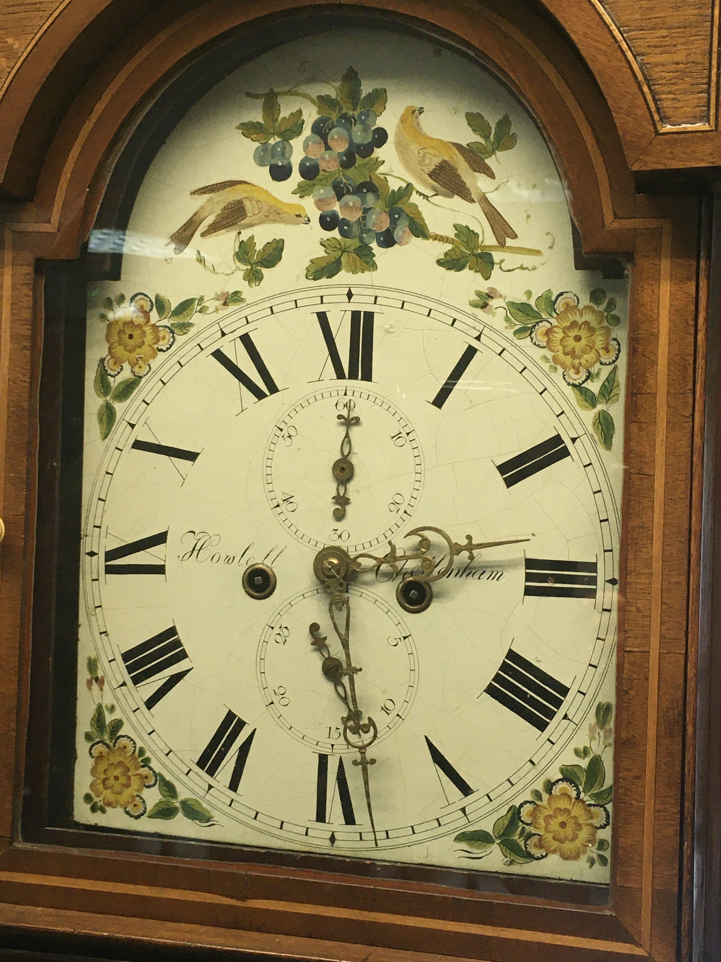 A mahogany long case clock the painted dial with Roman numerals