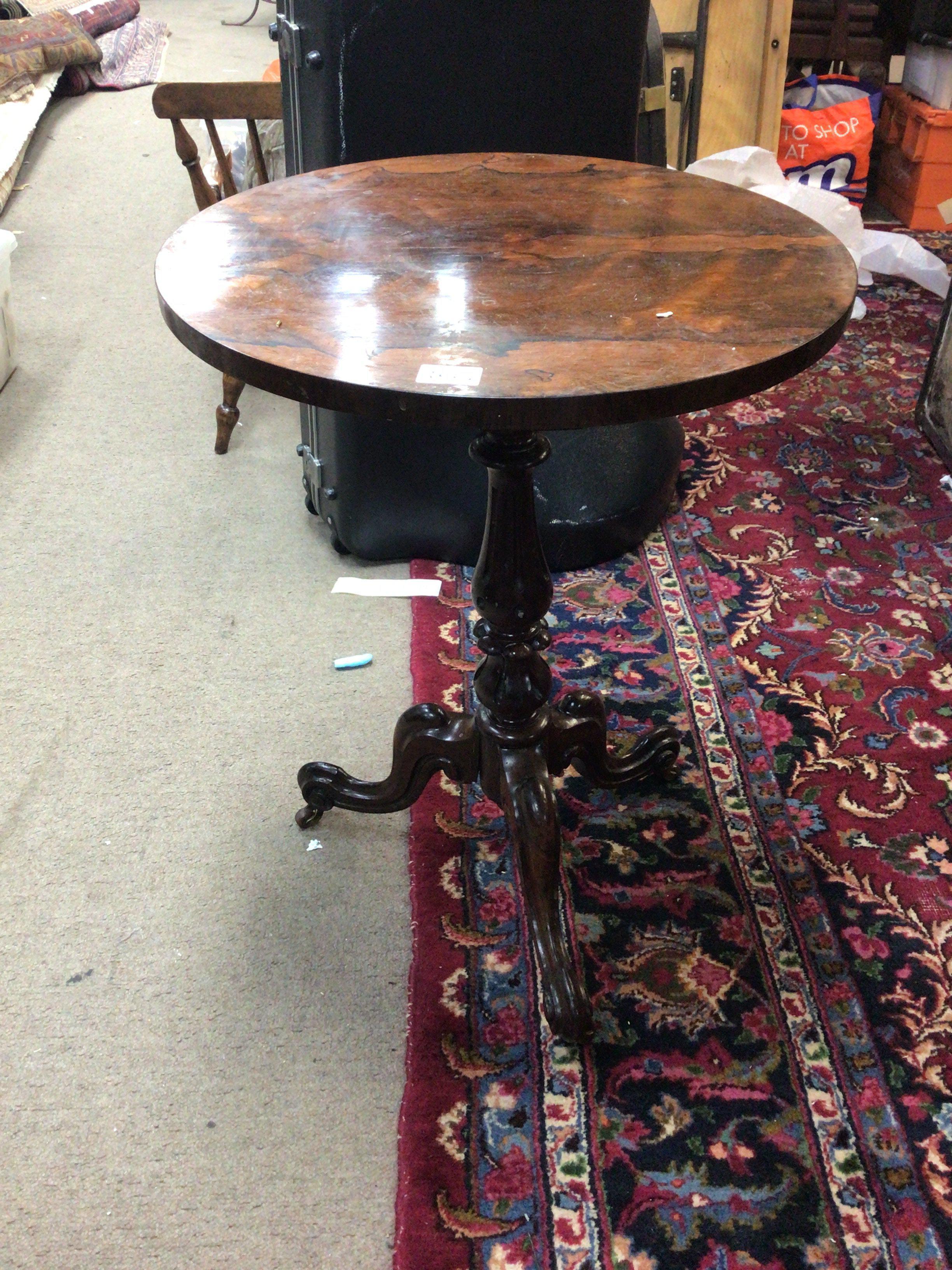 A quality rosewood occasional table the circular top on a turned column and splayed legs. top loose but good colour. Top diameter 52cm
