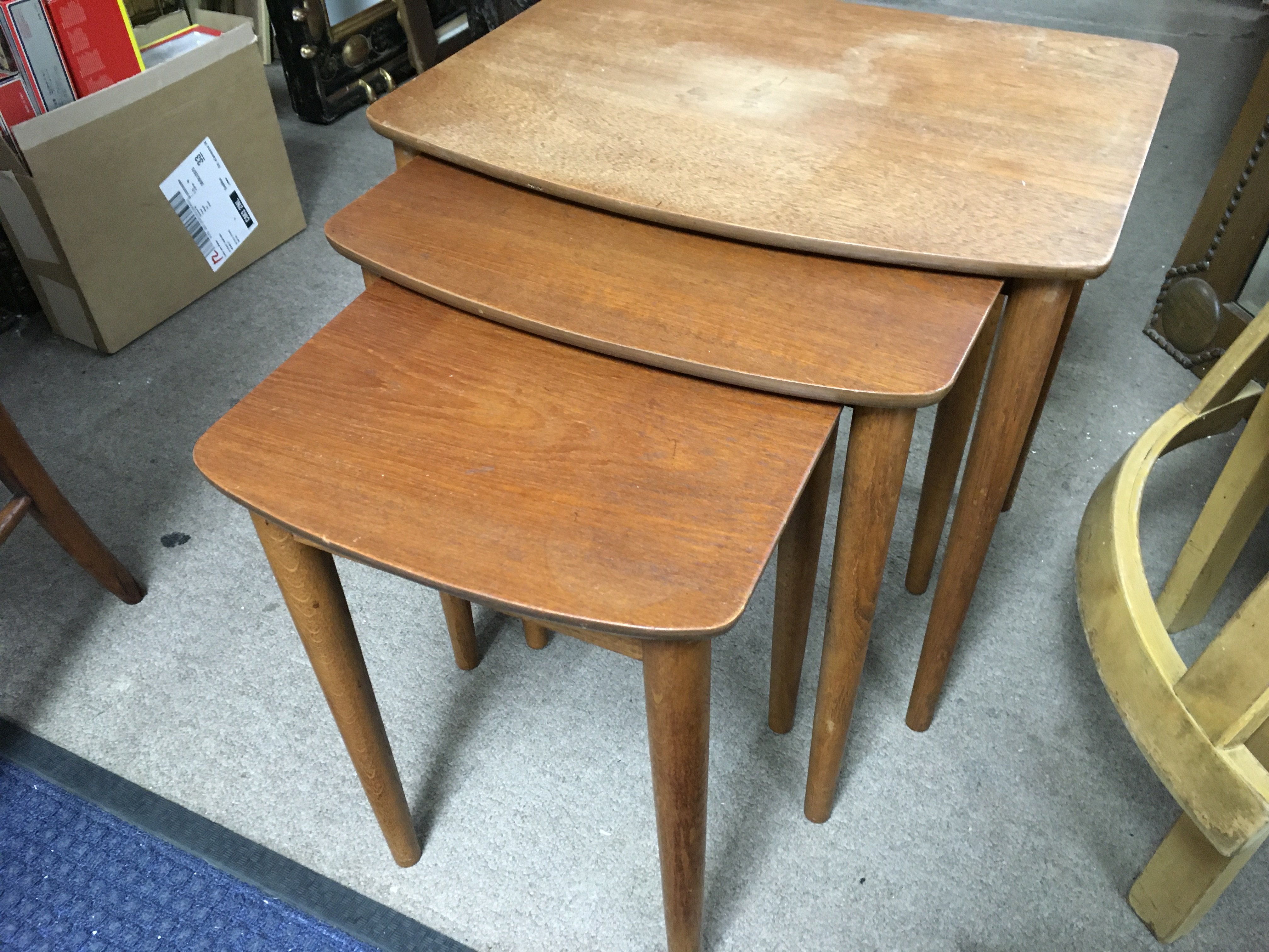 A teak nest of tables , largest 48cm tall