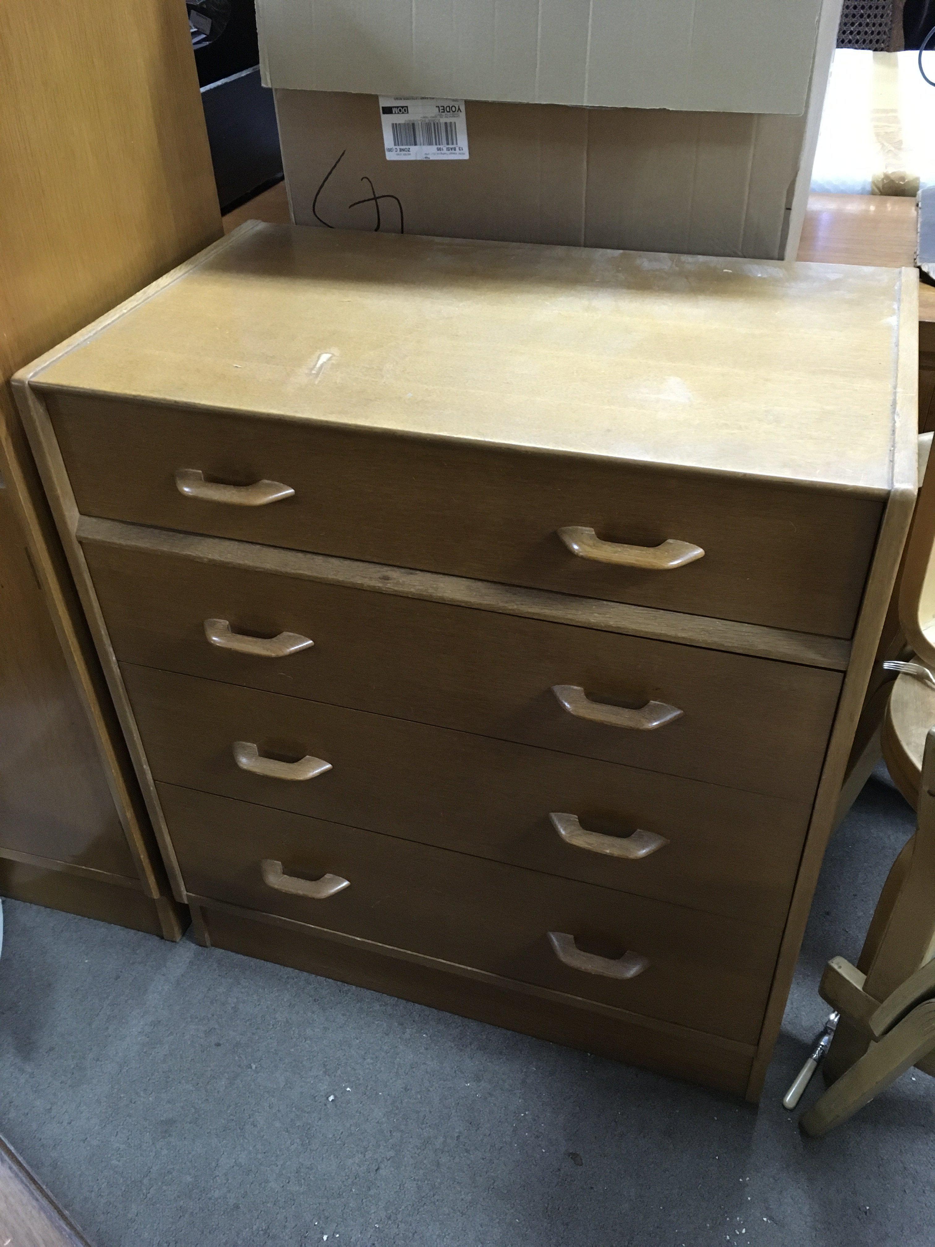 A mid 20th century oak G Plan chest of drawers (76cm wide 84cm tall) , Gentlemens wardrobe (88cm wide 122cm tall, and a pair of bedside tables .