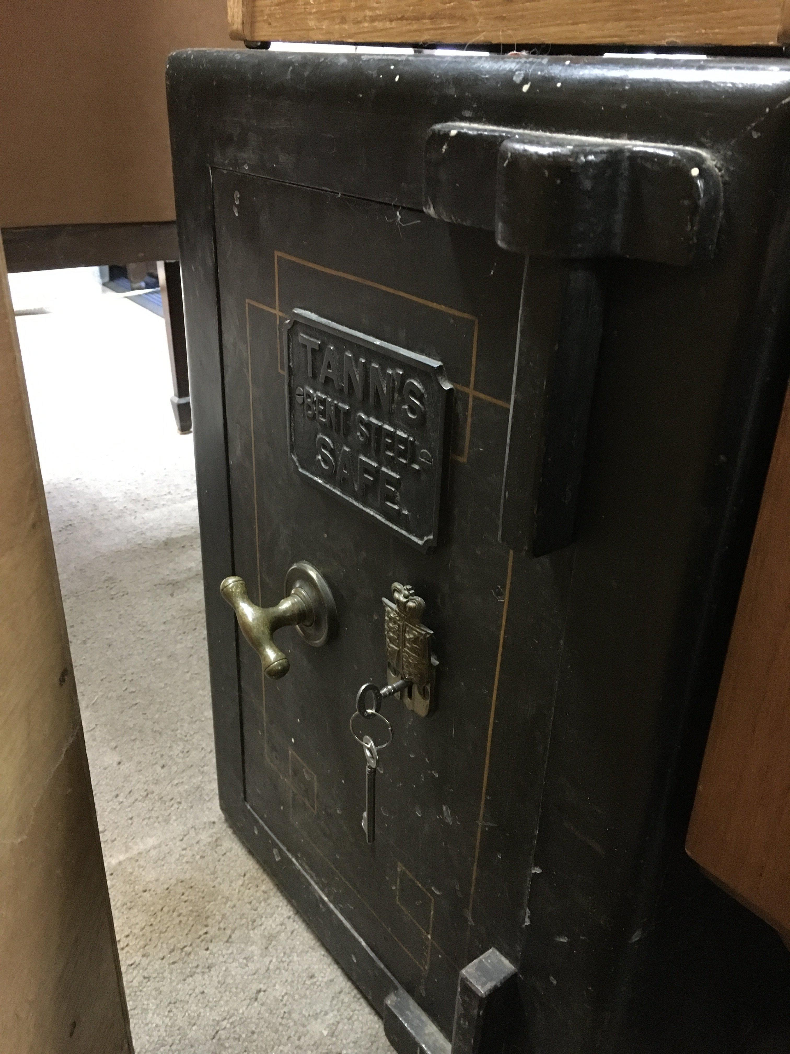 A Tanns bent steel Safe with key approximately 80cm tall 40cm wide