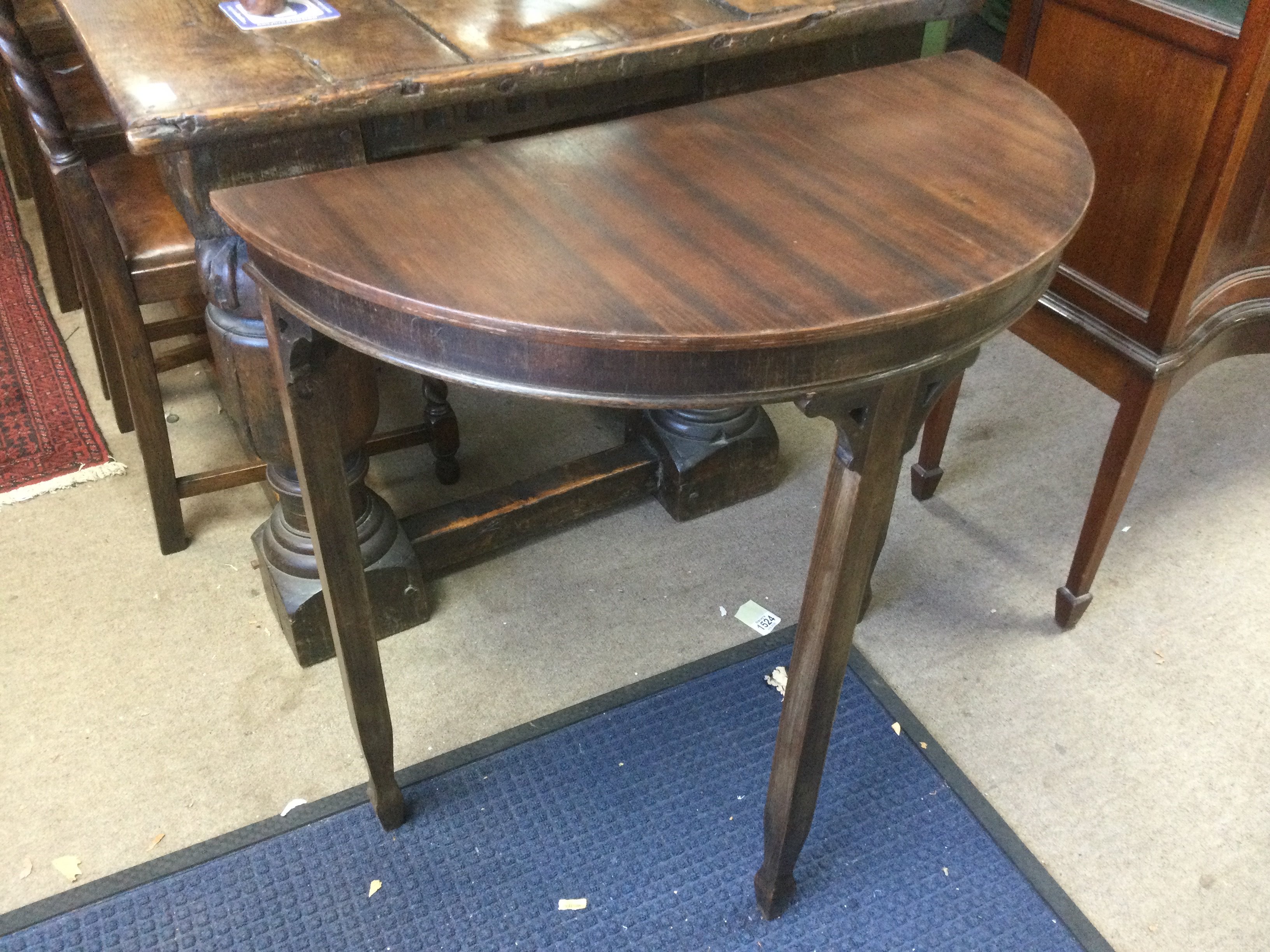 A small mahogany demi lune hall table. Shipping category D.