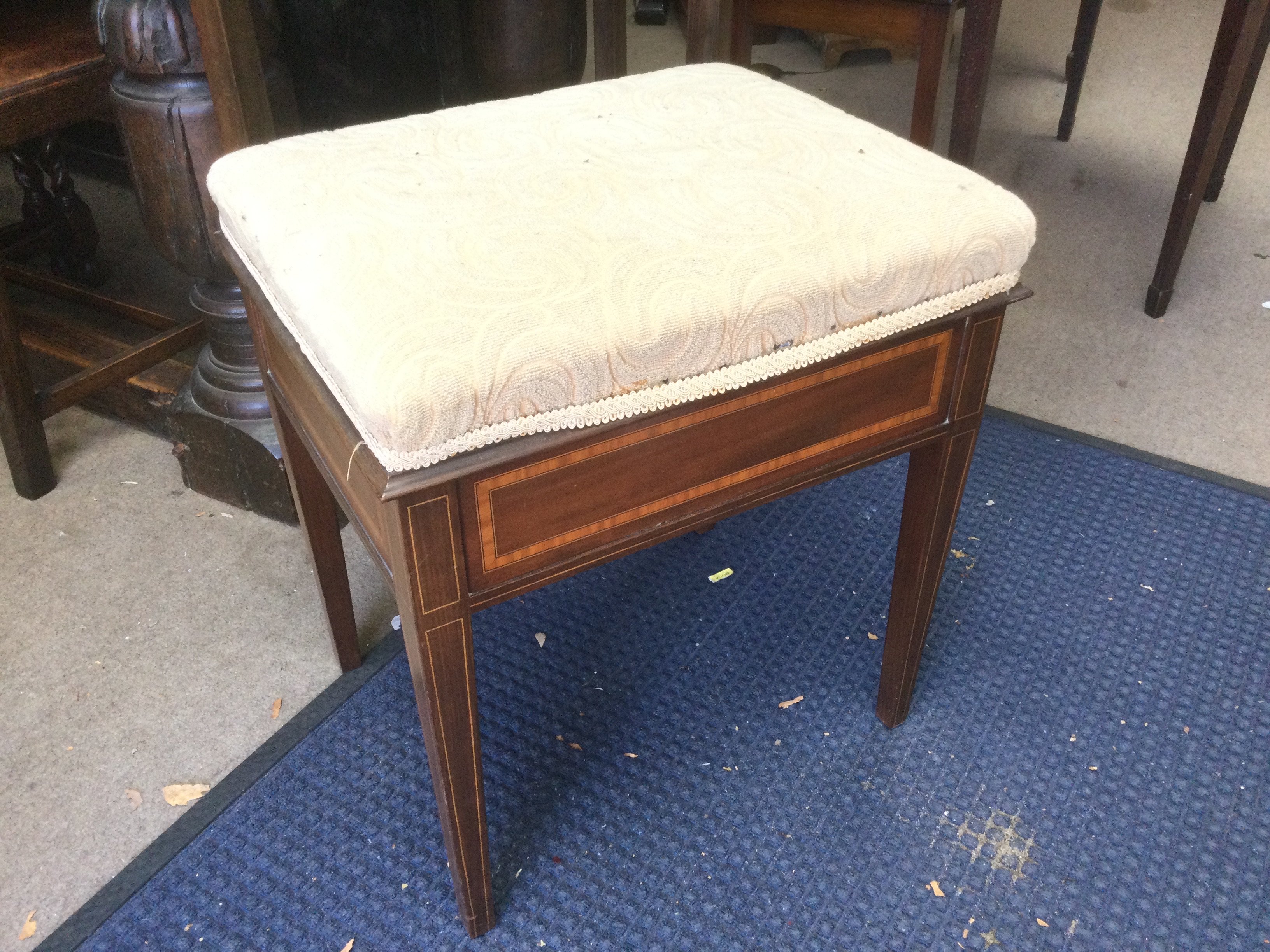 An inlaid mahogany piano stool. Shipping category D.