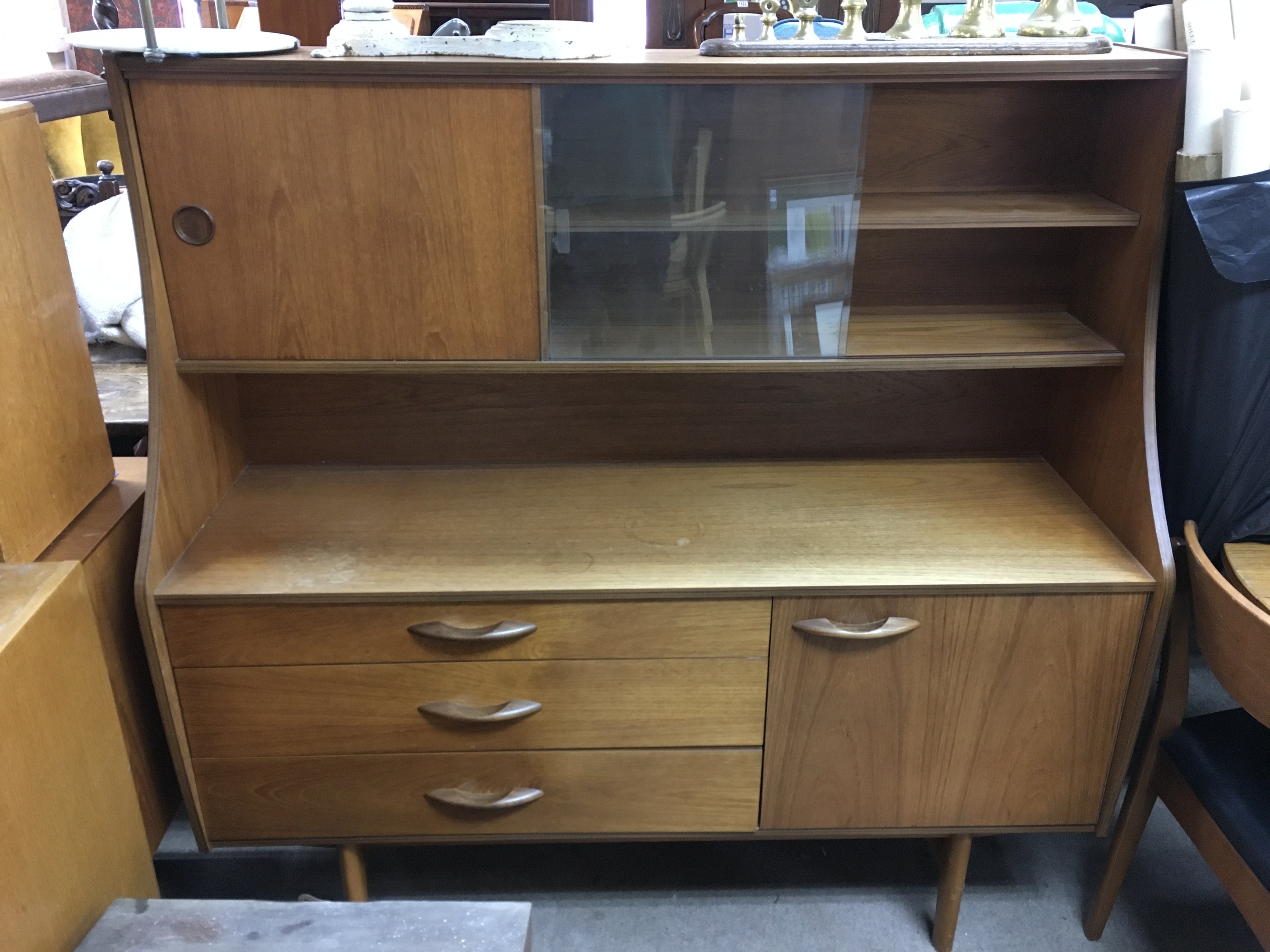 A teak display cabinet 135cm wide 50cm long 135cm tall