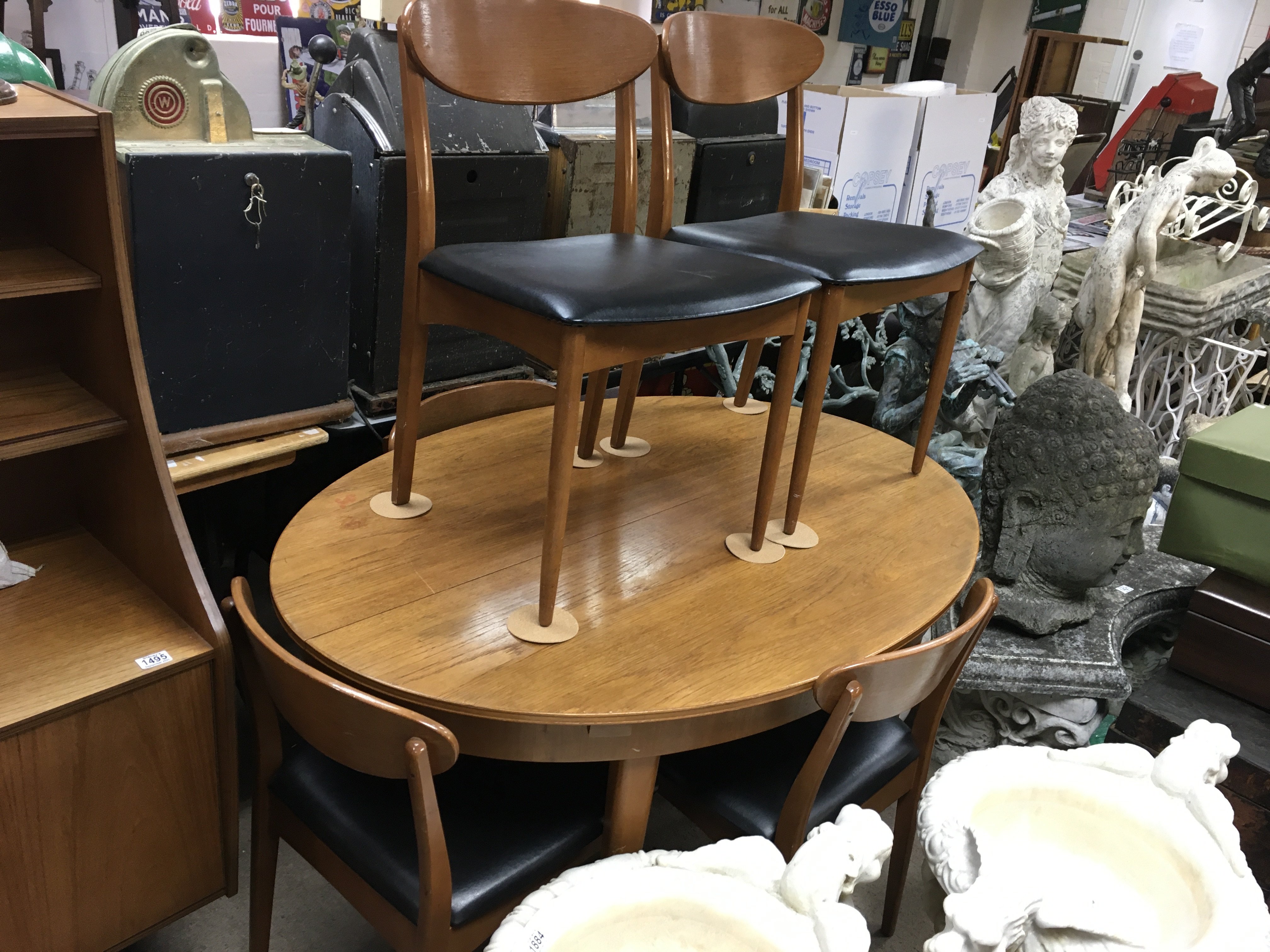 Mid 20th century design table with five curved back dining chairs , table dimensions 74cm tall 137cm wide