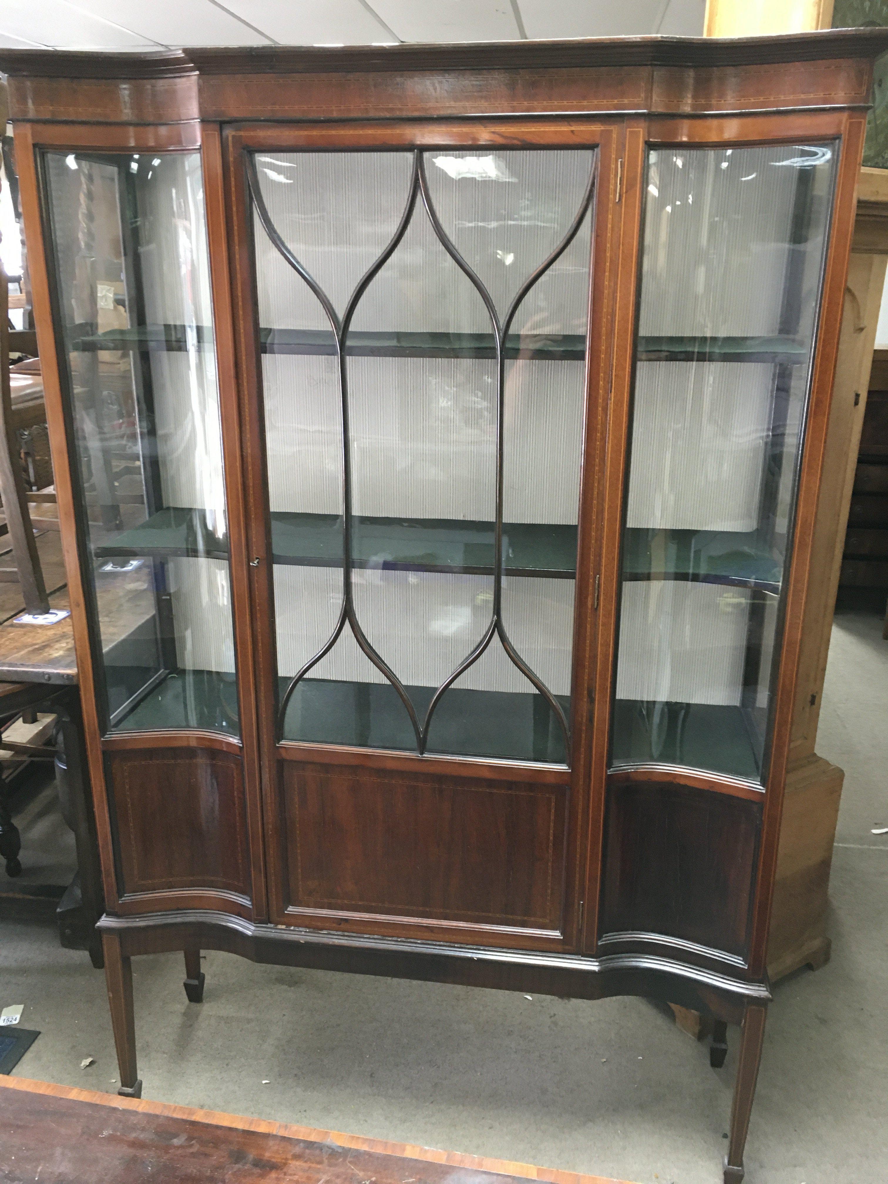 An Edwardian display cabinet 114cm wide 182cm tall