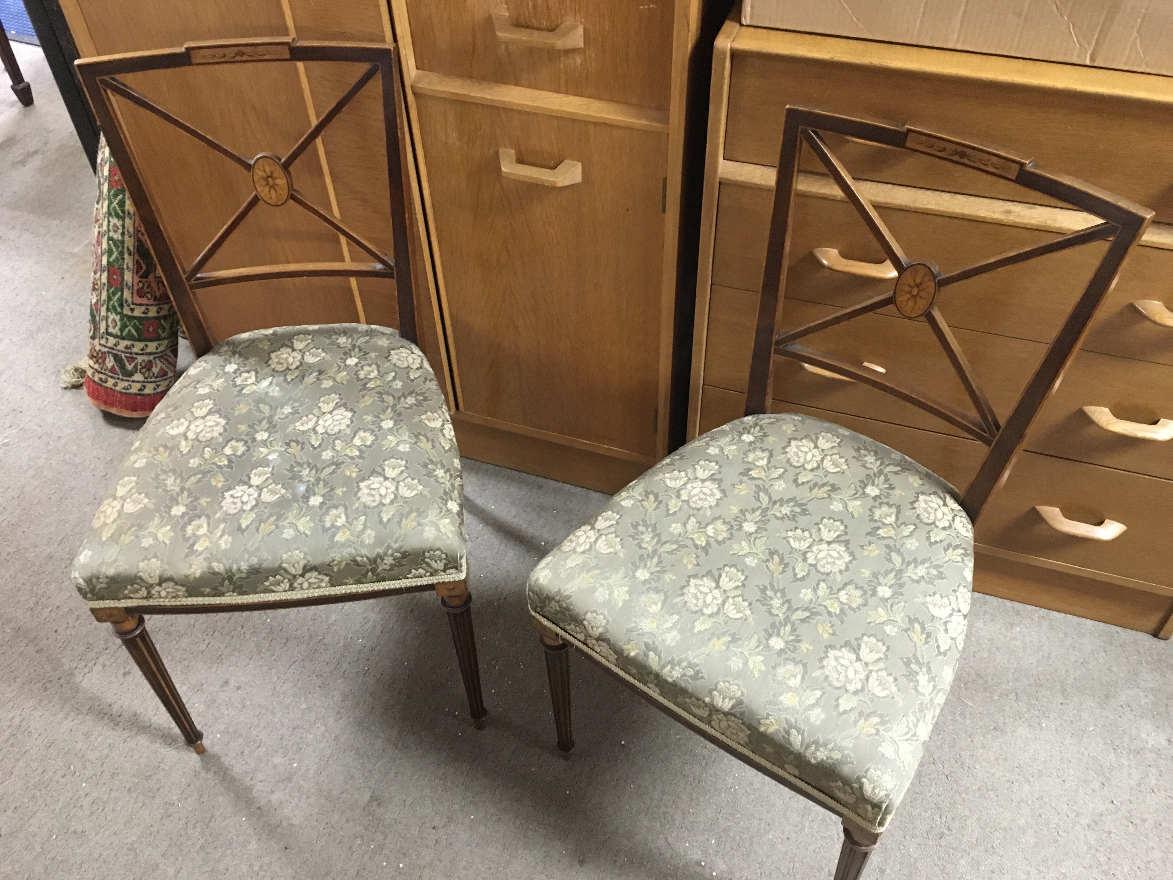 Two floral upholstered Edwardian chairs and a mahogany snap top tripod table