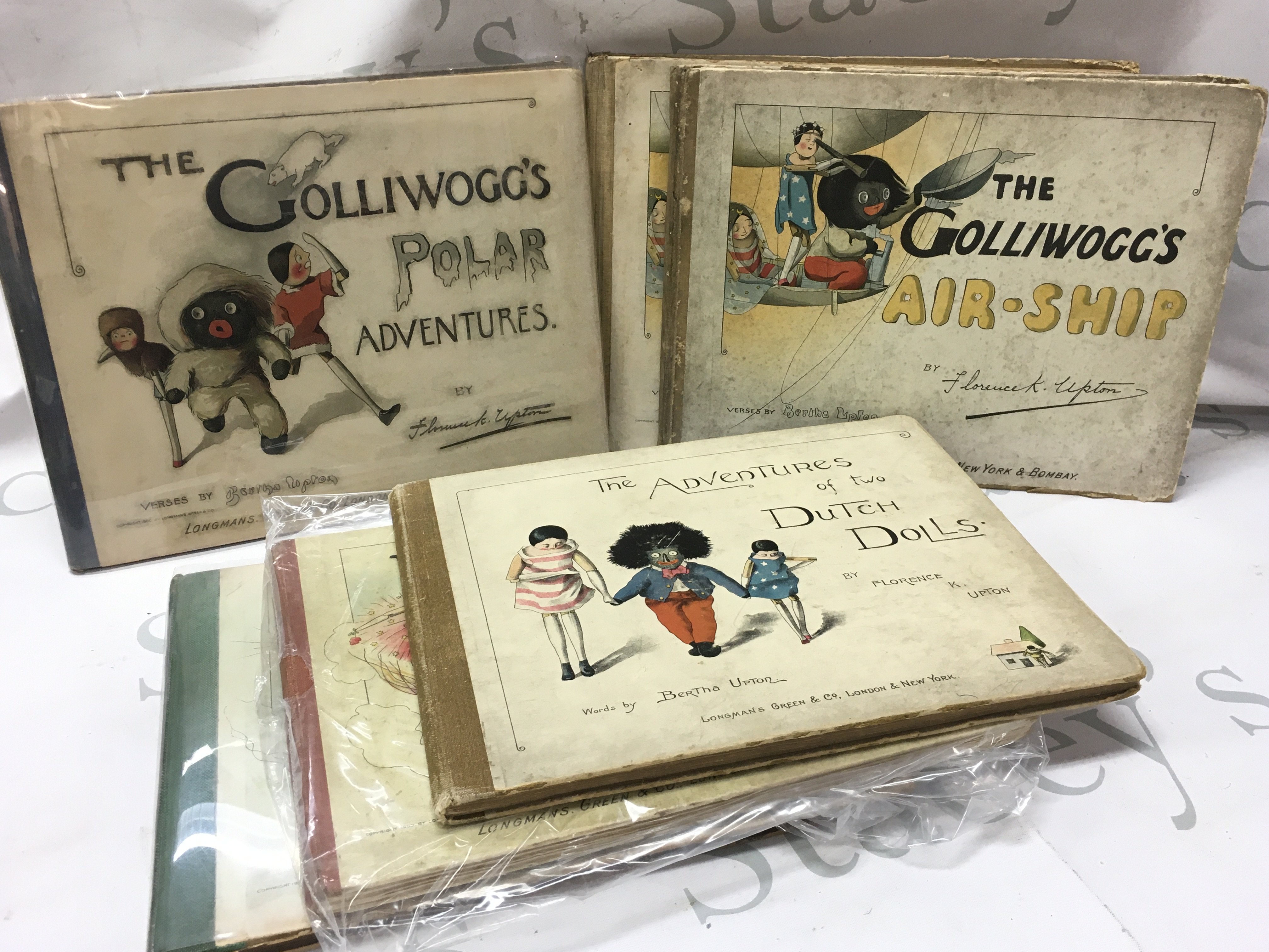 A collection of vintage Florence Upton books including The Adventure of the Dutch Dolls, Polar Adventures, Air-Ship. Postage category C