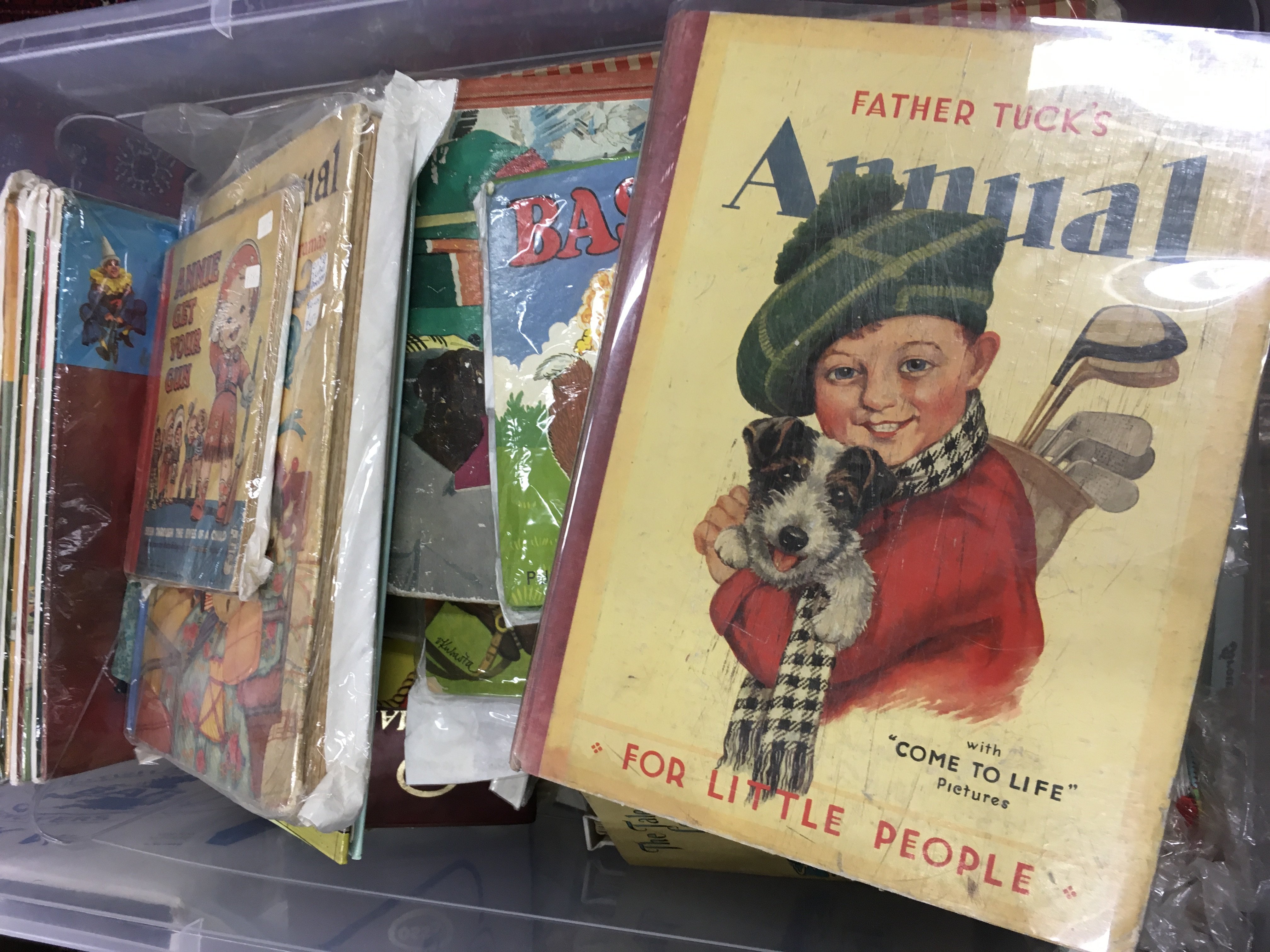 A large collection of 20th century children's books including pop up books, Father tucks annual, Annie get your Gun , vintage maps, tale of a lonesome lamb, Enid Blyton magazine, Cinderella Magic wand book, Tin Tin, Puss in Boots, Andy Pandy and the queen of hearts pop up book Etc. This lot cannot be posted