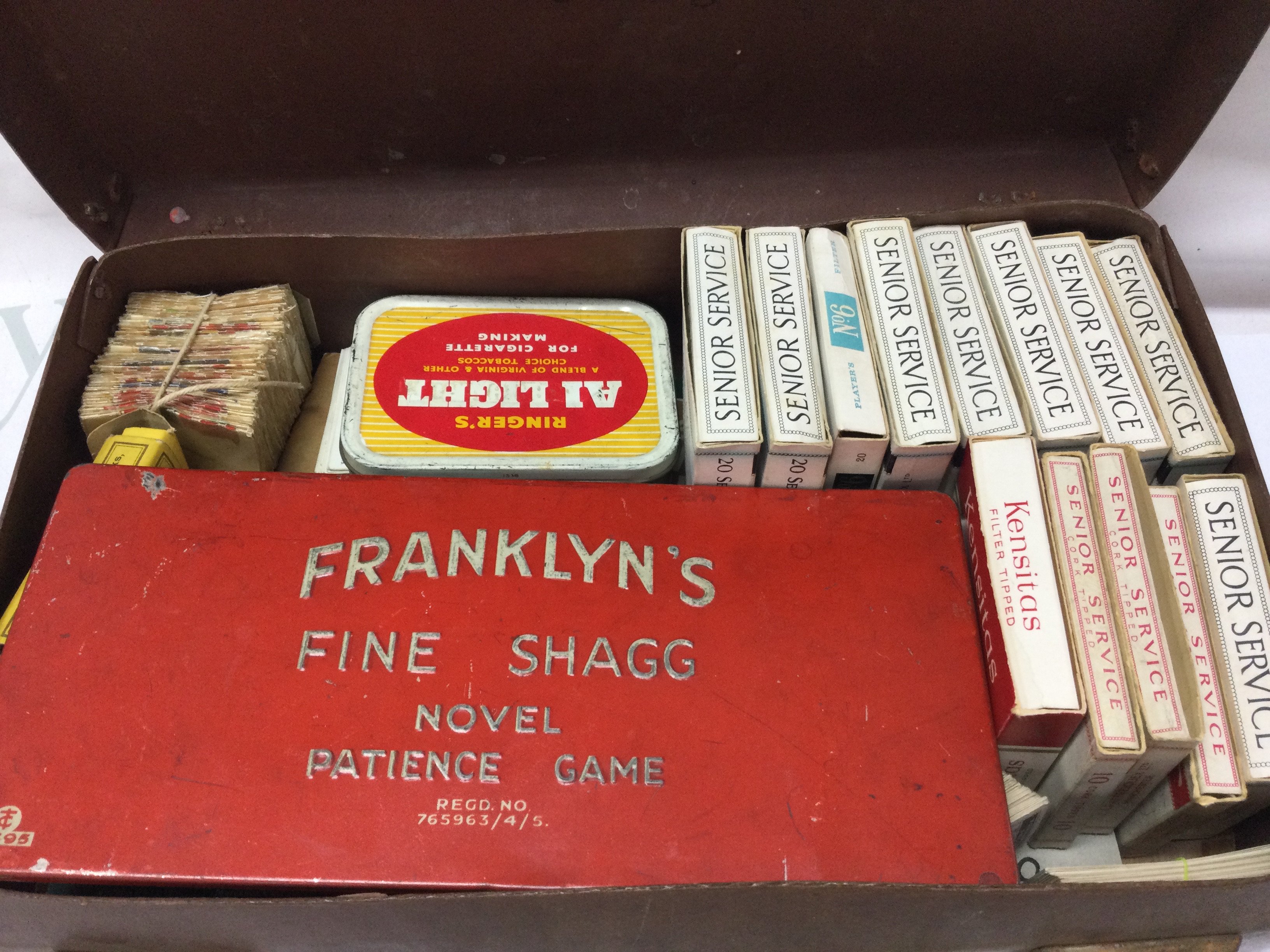 A briefcase with cigarette/ trade cards and Franklyns fine shagg patience game. Postage category B