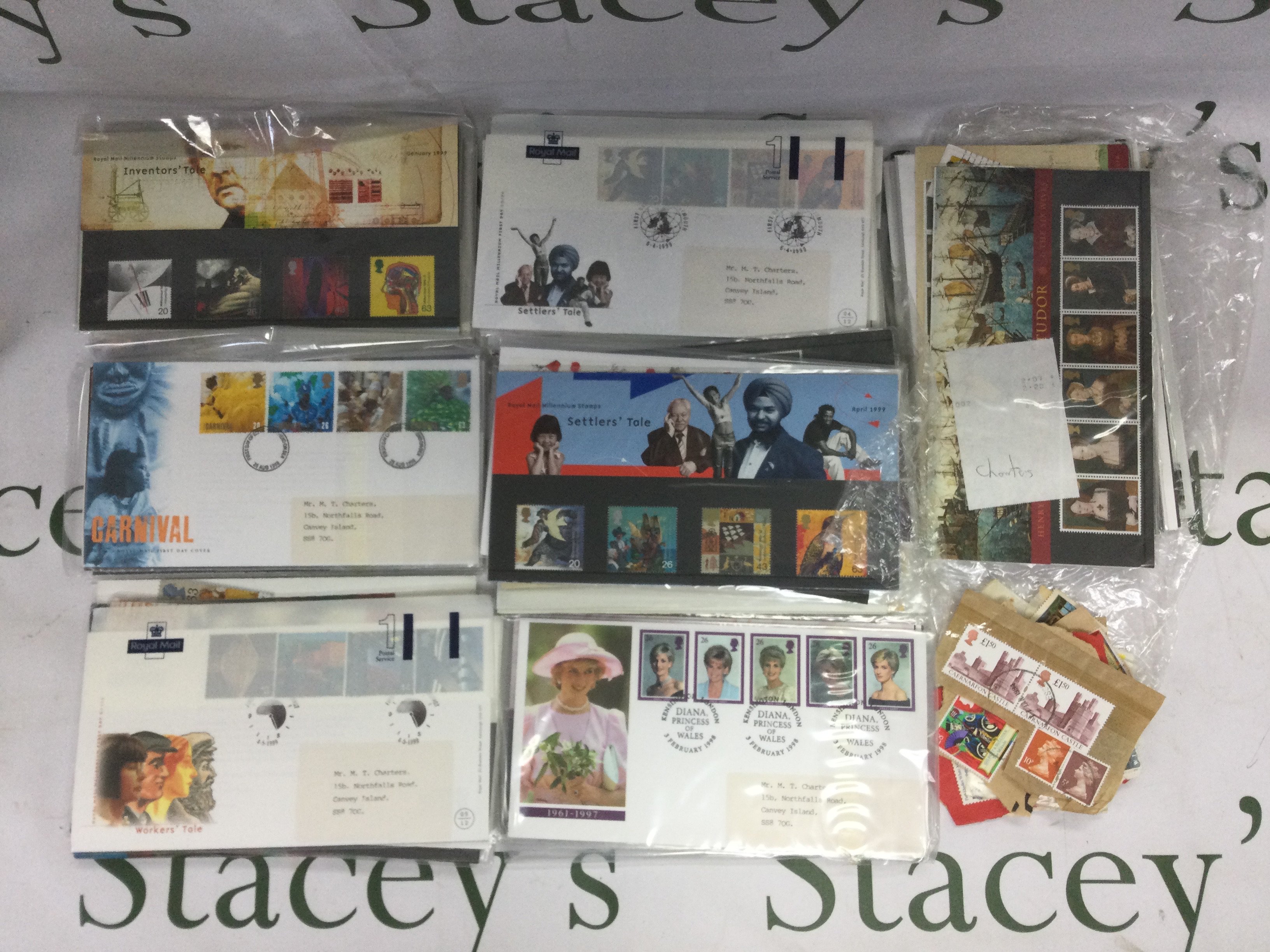 Three tins of stamps and presentation packs. Shipping category C.