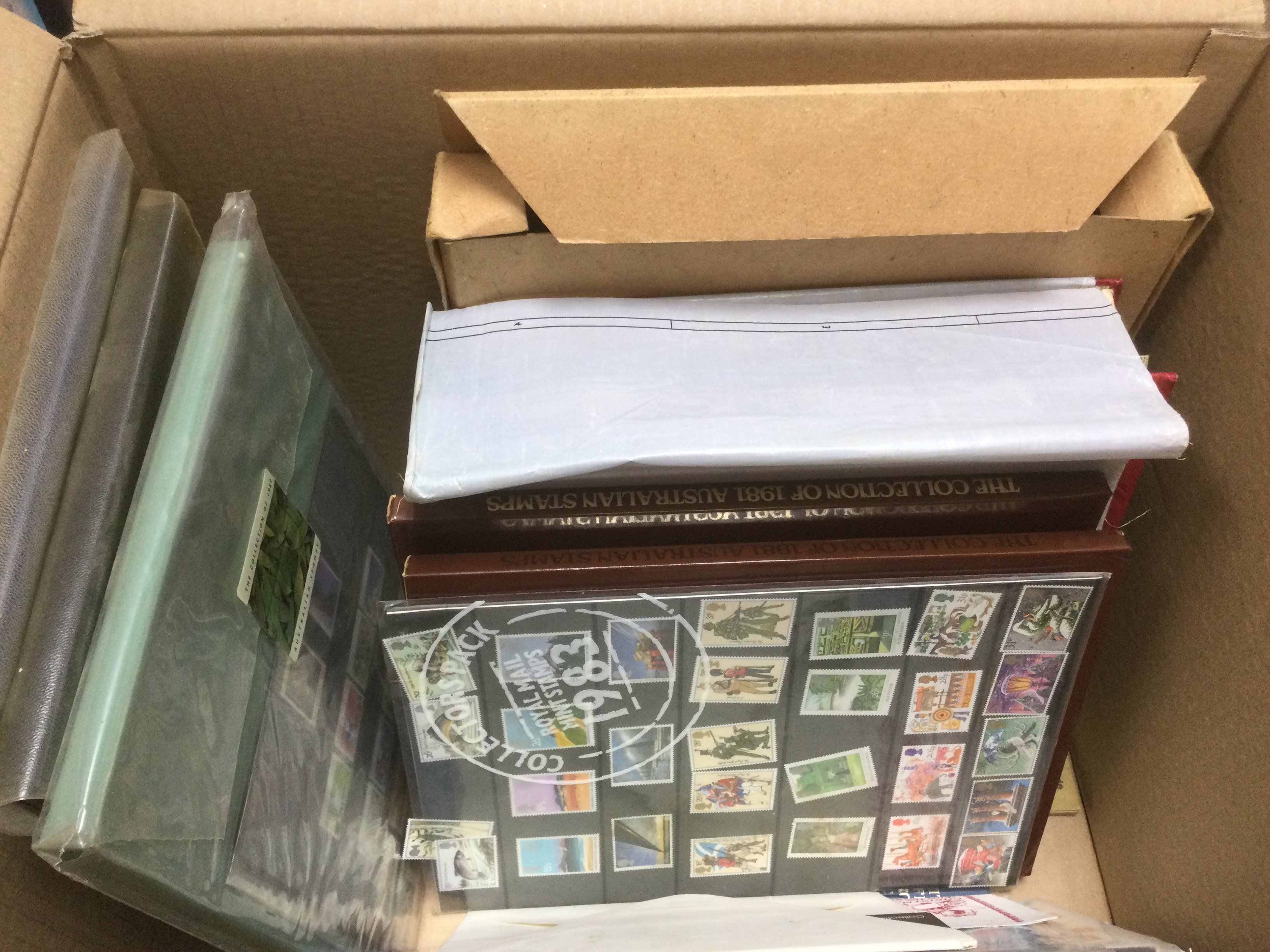 A box of GB and world stamps, loose and in albums. Shipping category D.