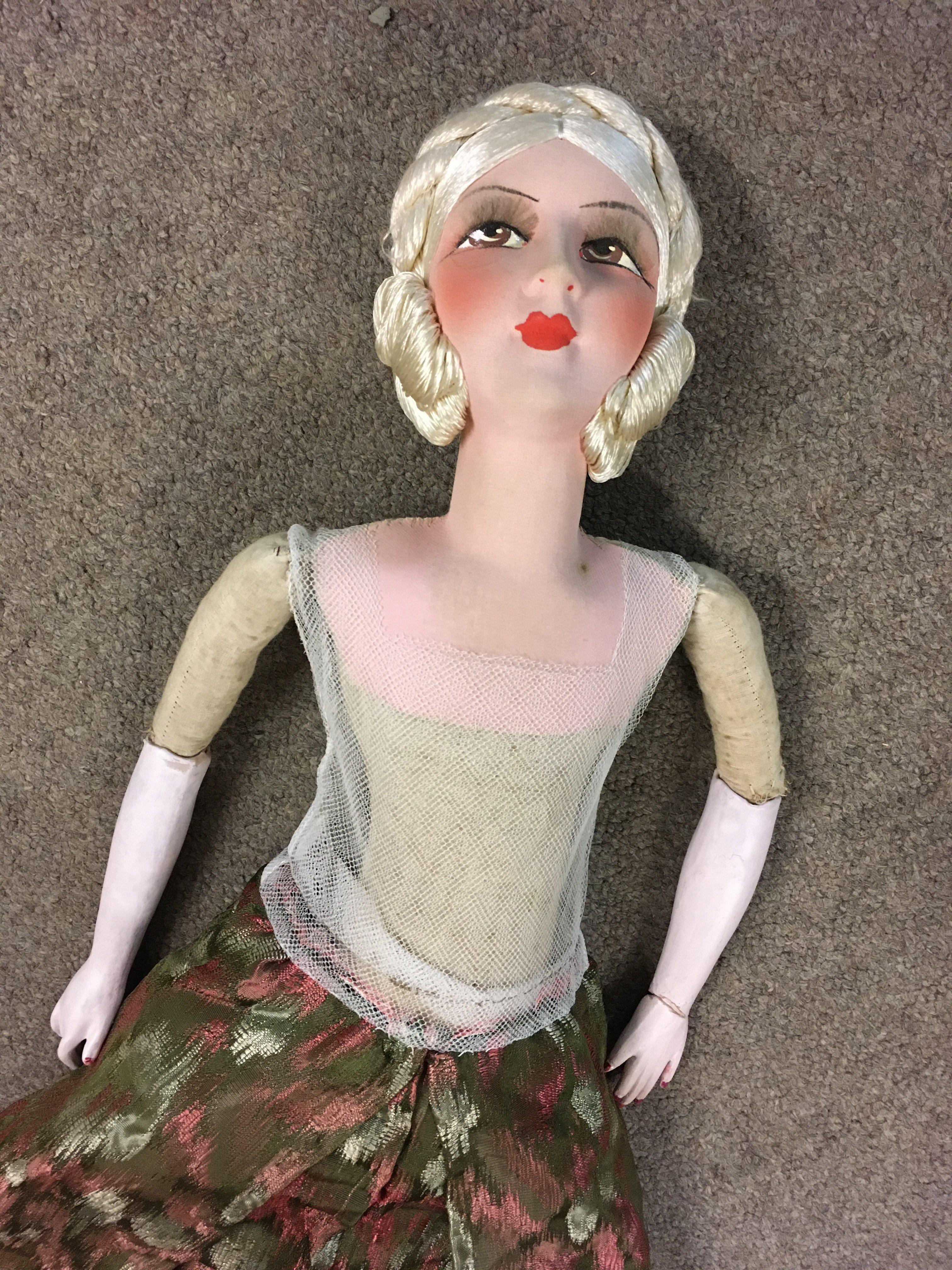 A large 1950's doll. Damage to left wrist- NO RESERVE