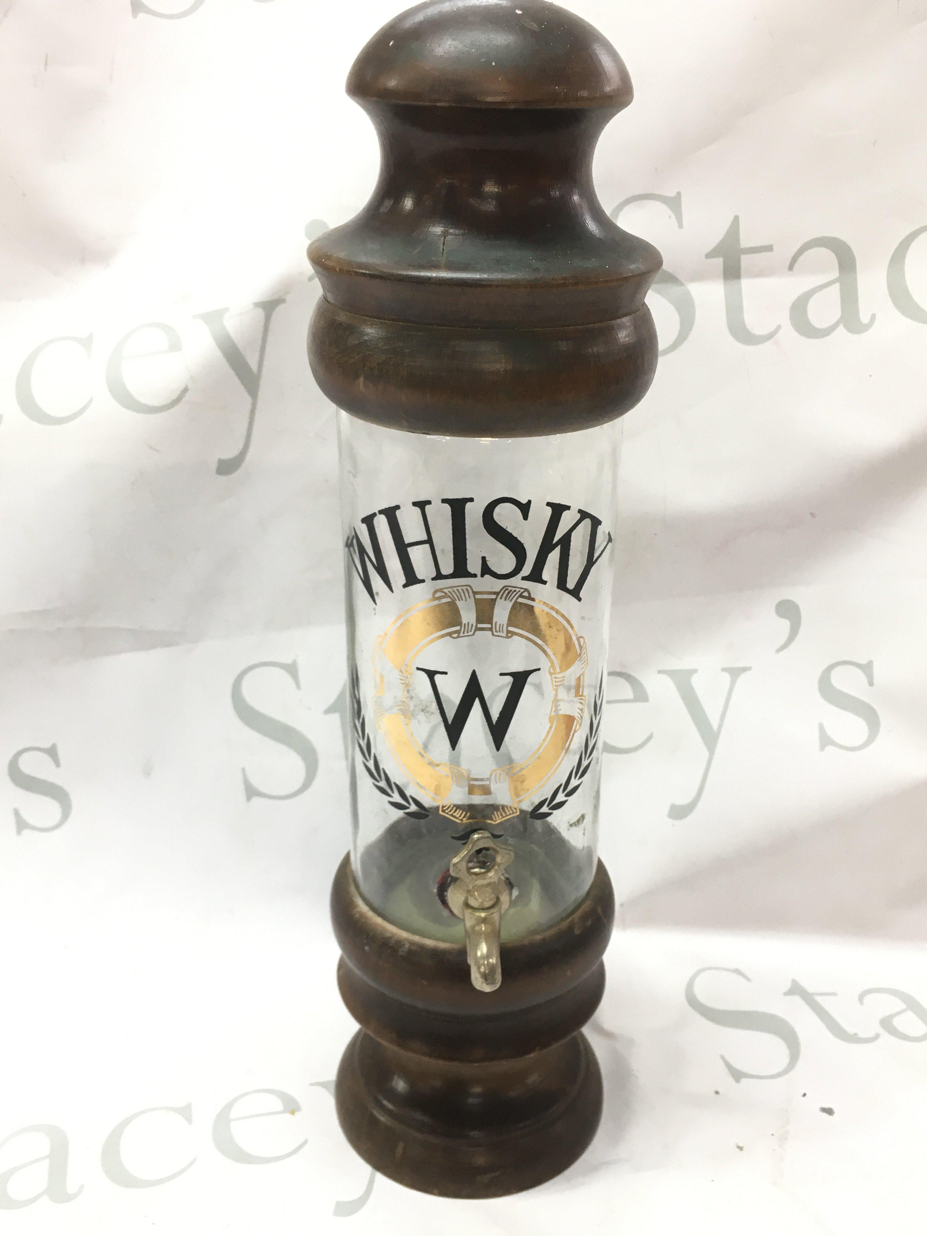 A glass whisky container with brass tap on wooden base and top, this lot cannot be posted