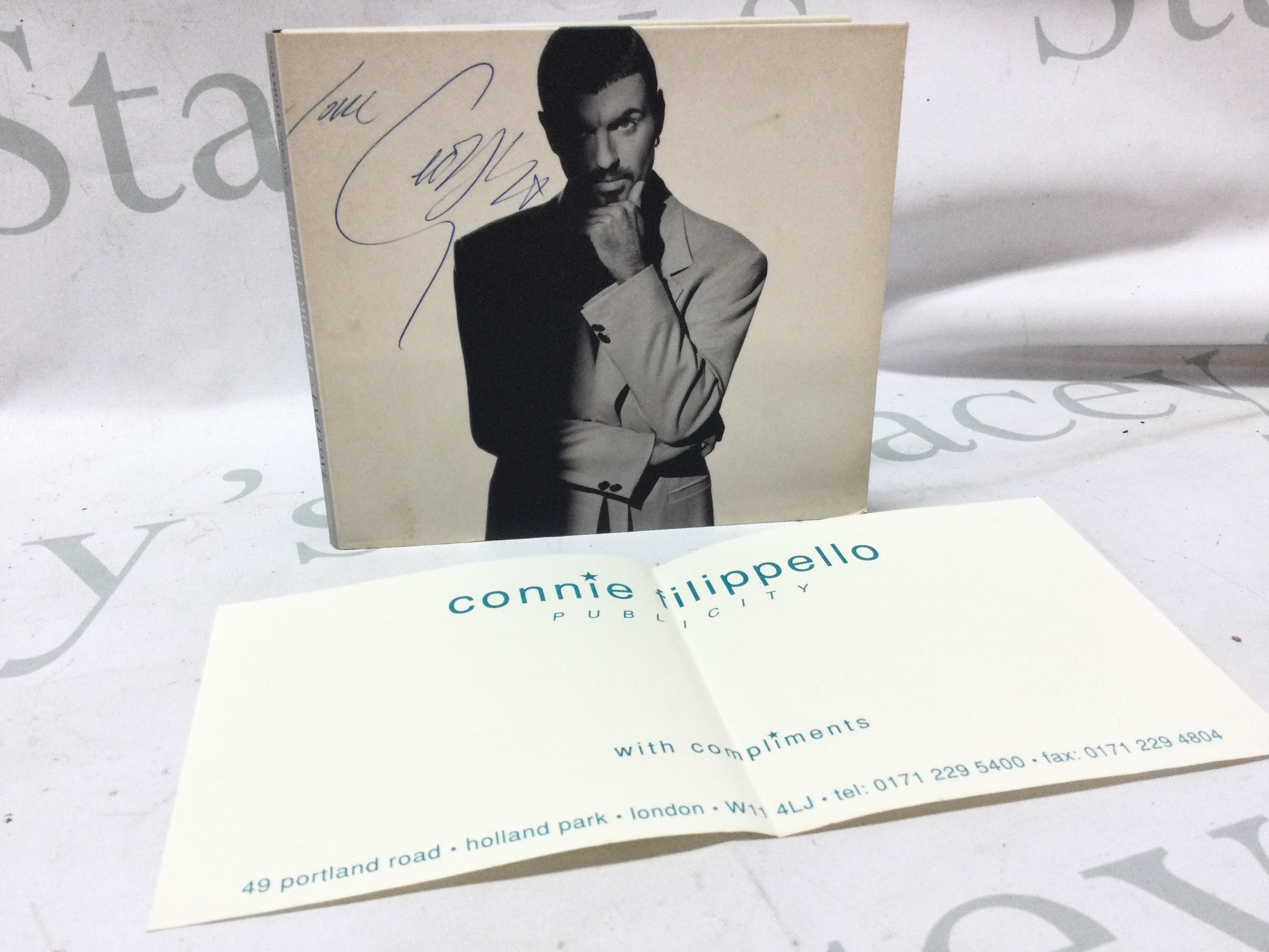 A signed George Michael Promo CD . Postage category A
