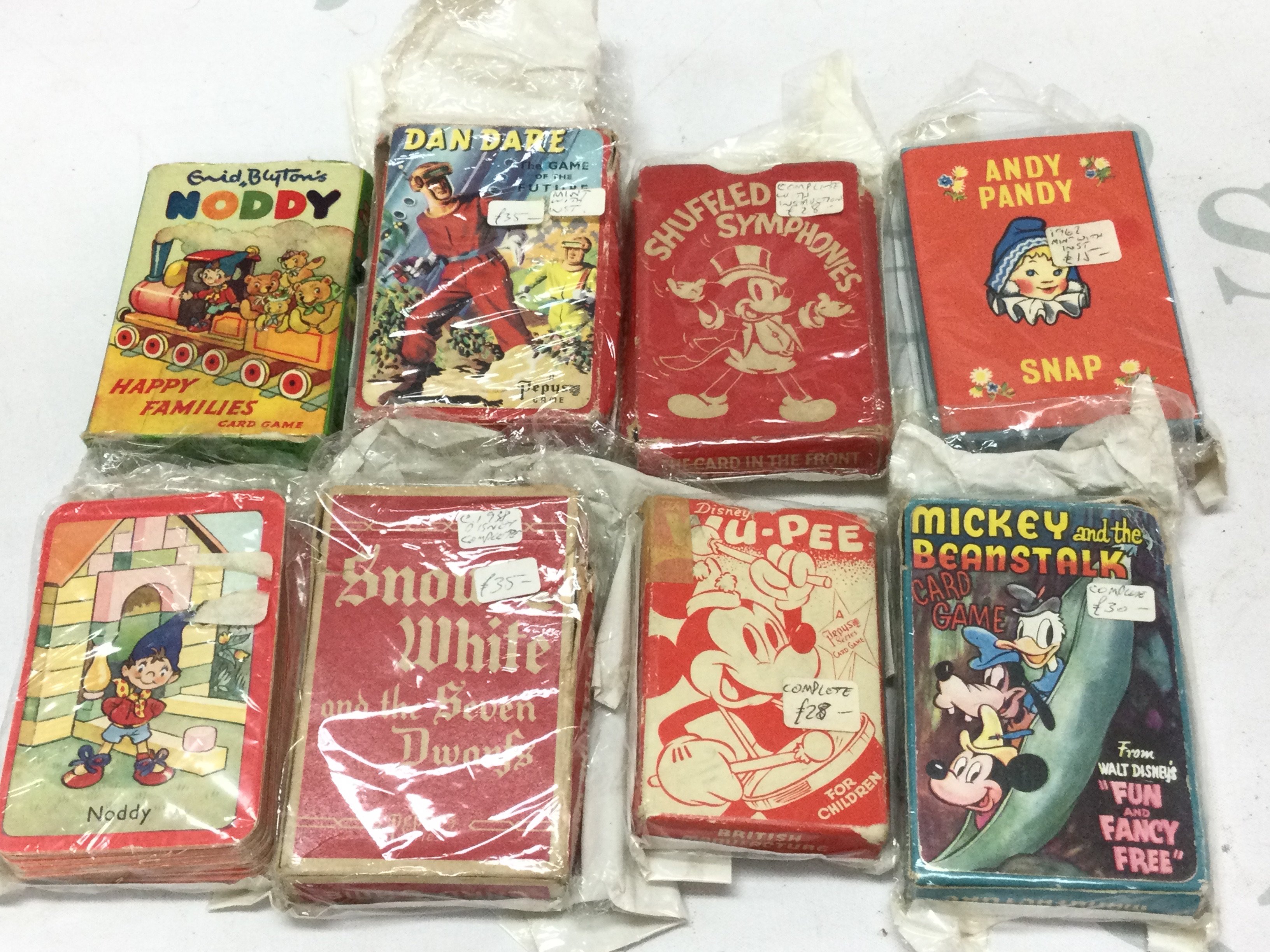 A collection of vintage playing cards Including Disney, Noddy, Dan dare etc. postage category B